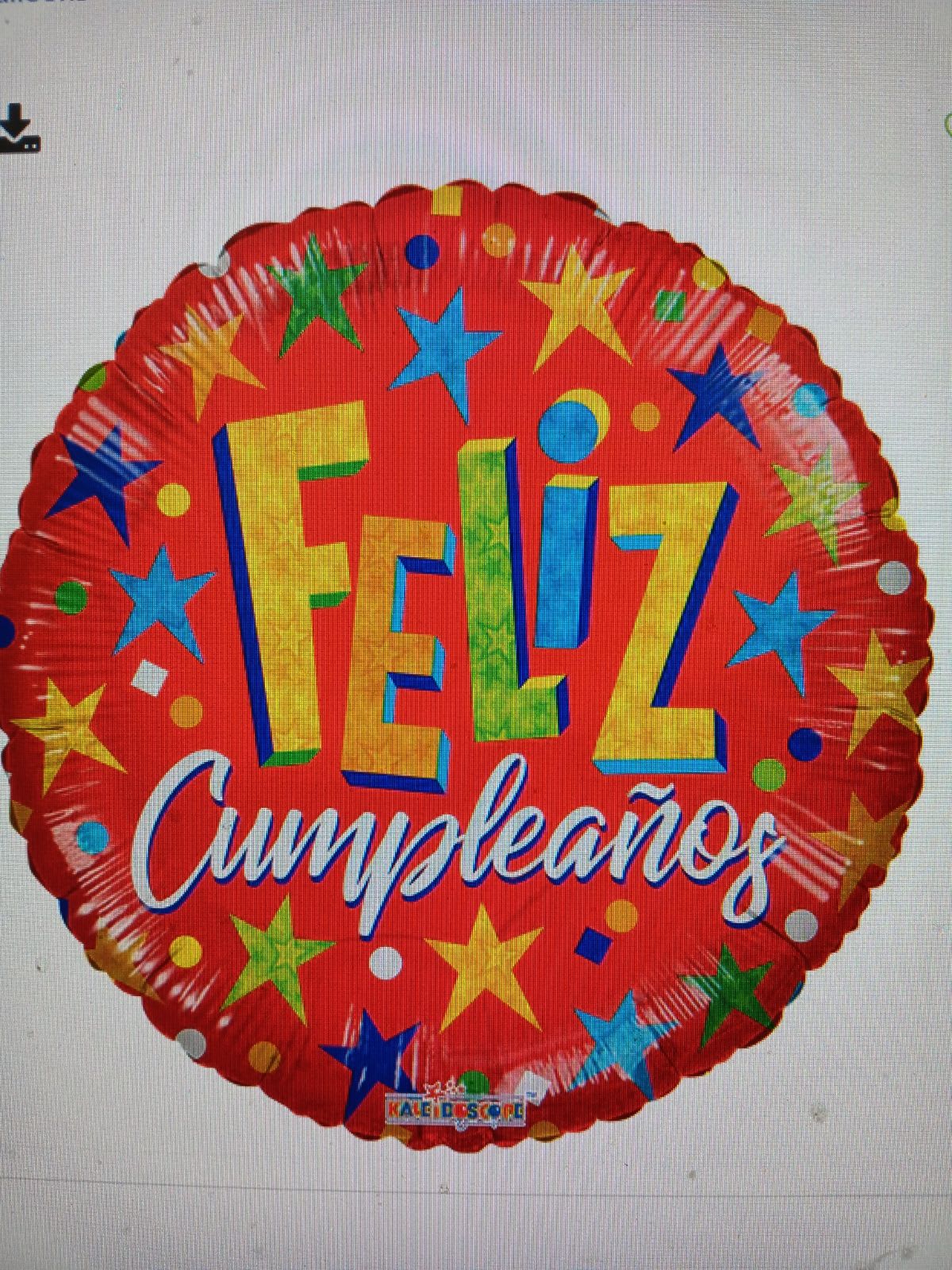 Round red birthday balloon with stars and the words Feliz Cumpleaños