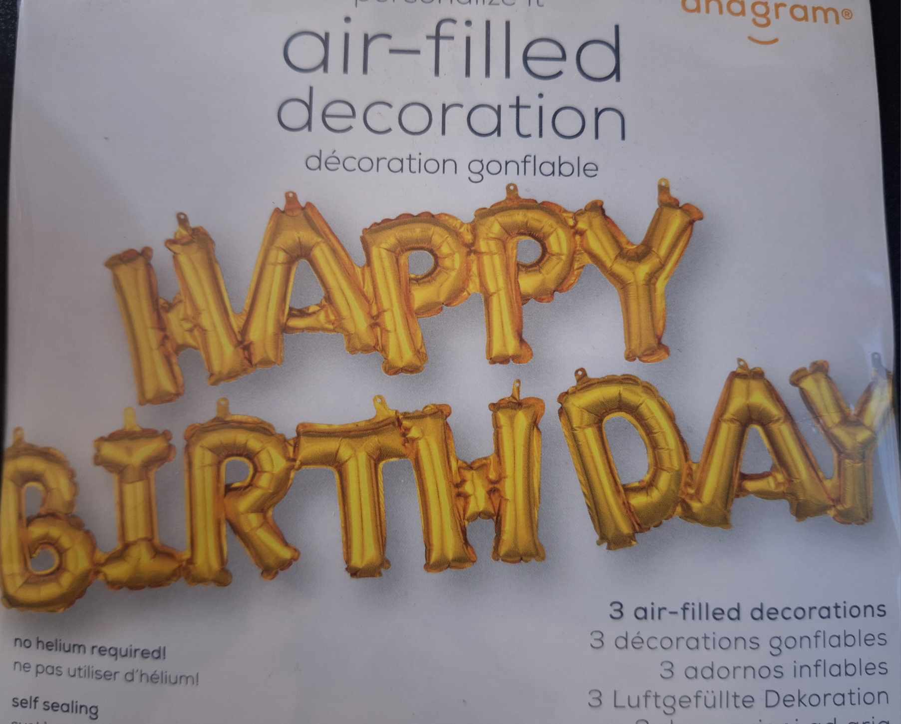 Gold birthday letter balloons on product packaging