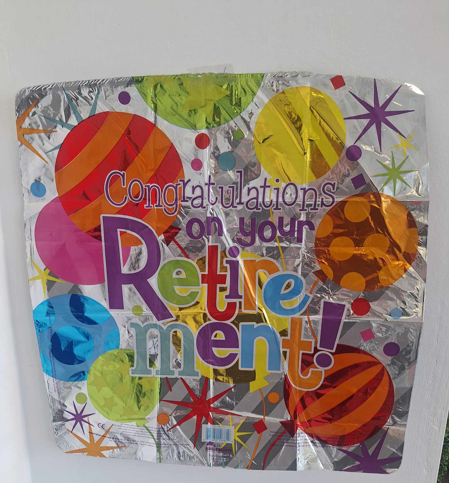 Foil balloon reading "Congratulations on your Retirement!"