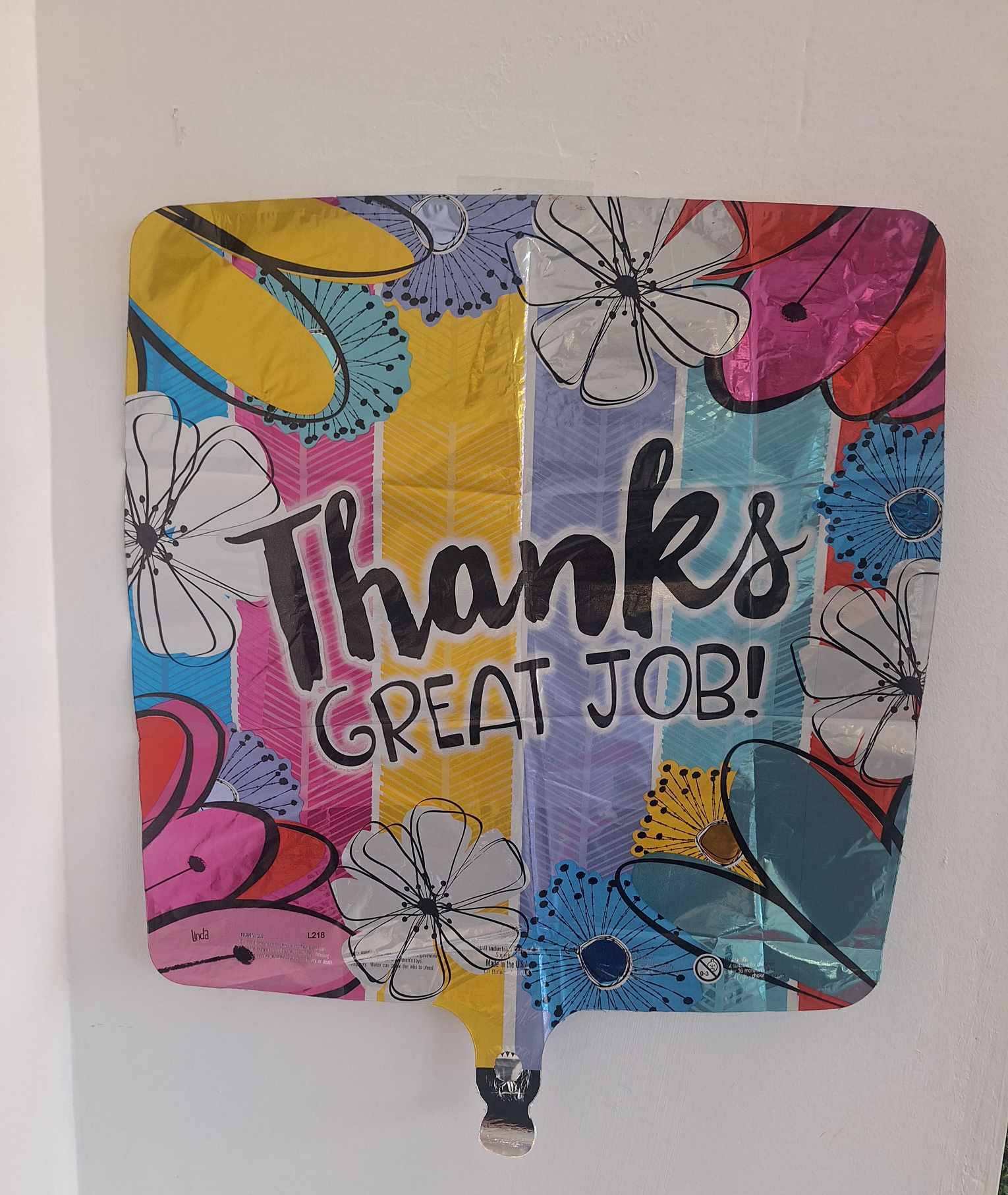 Colorful balloon with "Thanks Great Job!" text and floral graphics