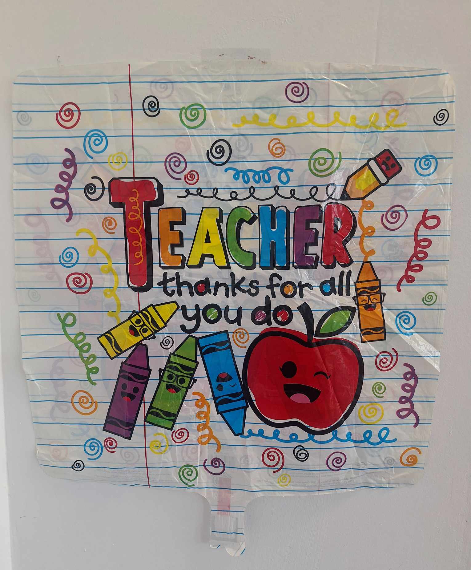 Teacher appreciation poster with crayons and an apple