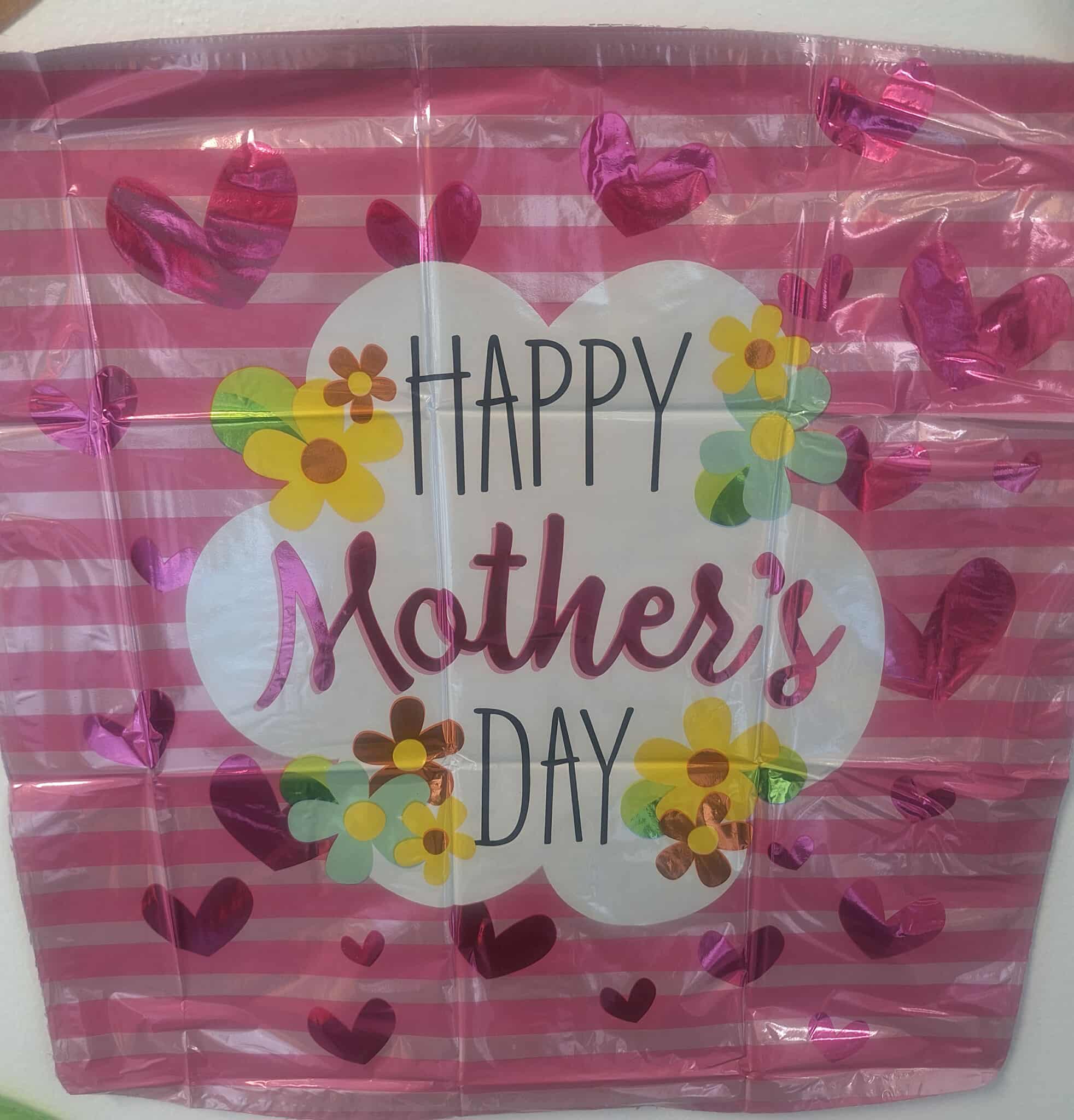 Pink Mother's Day gift bag with heart and flower graphics
