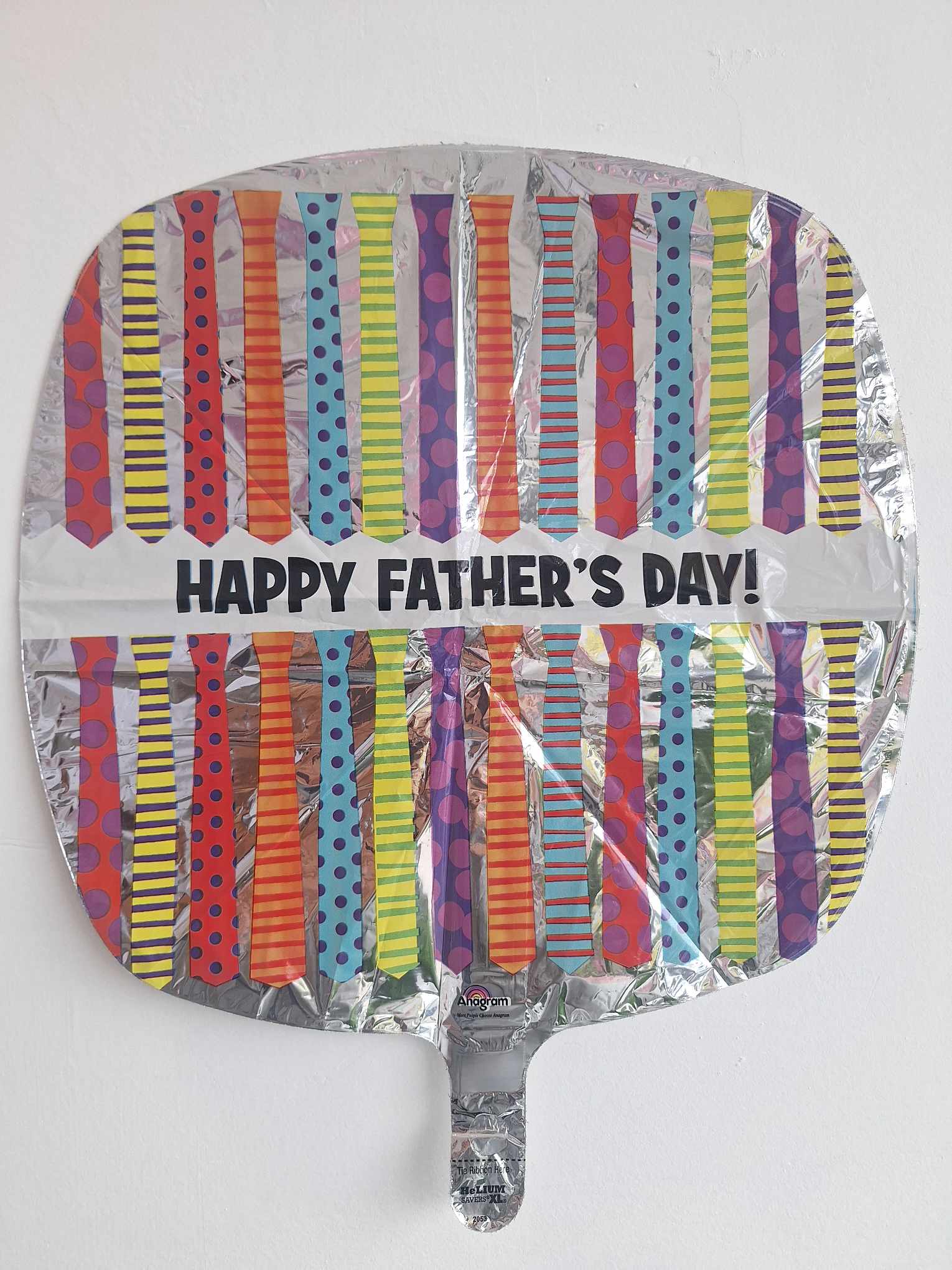 Round foil balloon with colorful tie patterns and "Happy Father's Day!" text