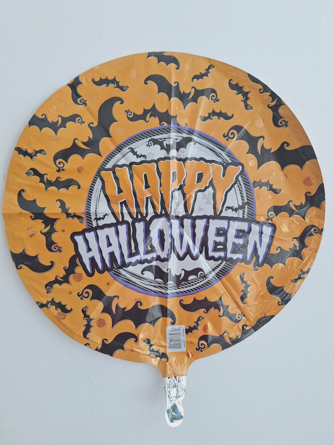Round Halloween balloon with bats and "Happy Halloween" text