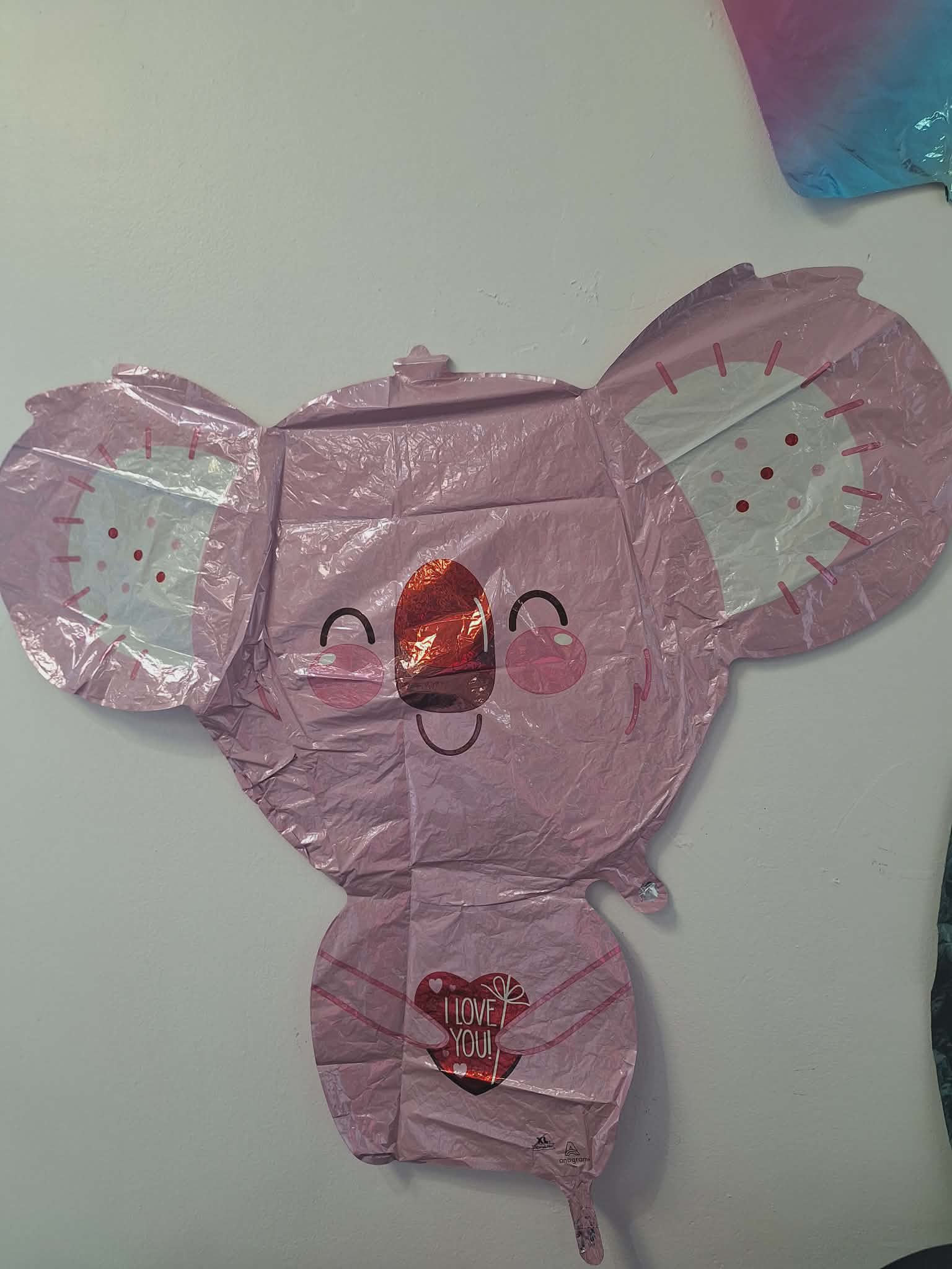 Pink koala-shaped foil balloon with a heart that says I LOVE YOU