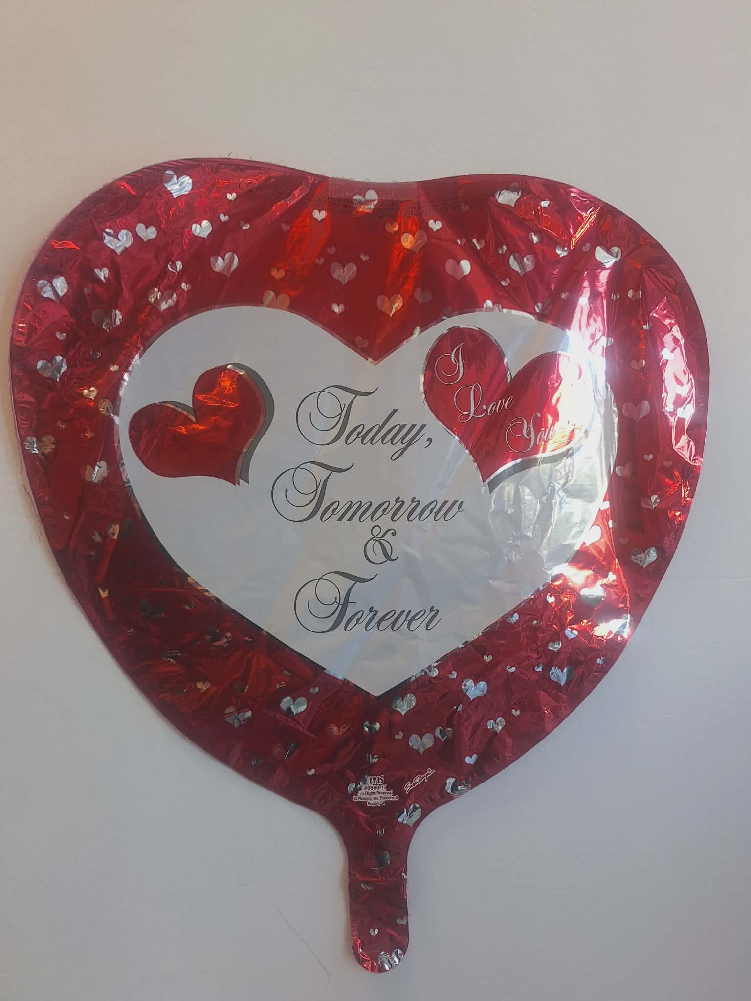Heart-shaped red foil balloon with the words "Today, Tomorrow &amp; Forever"