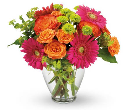 Bouquet of orange roses and pink gerbera daisies in a clear glass vase