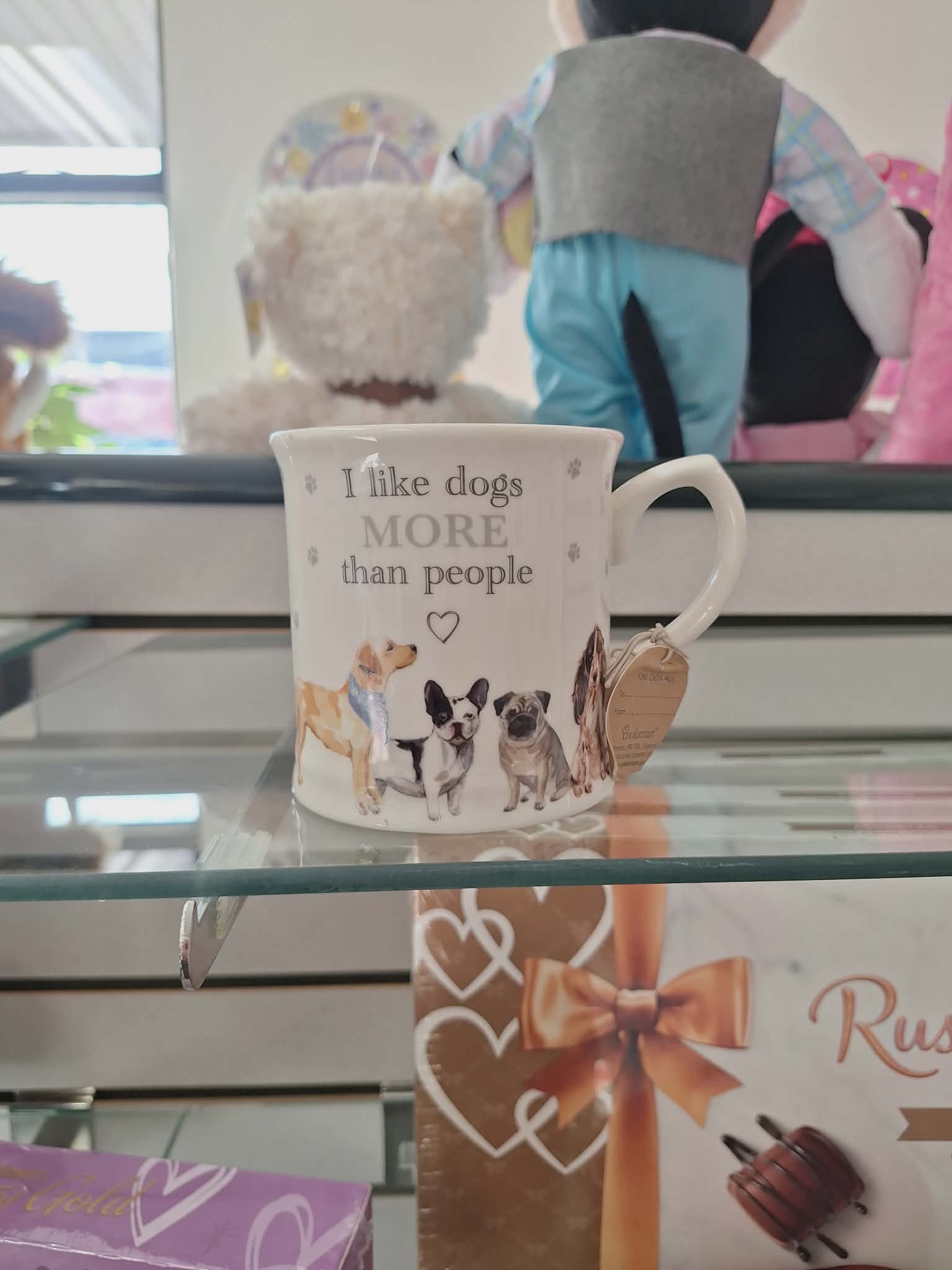 White mug with dog illustrations and the text "I like dogs more than people"