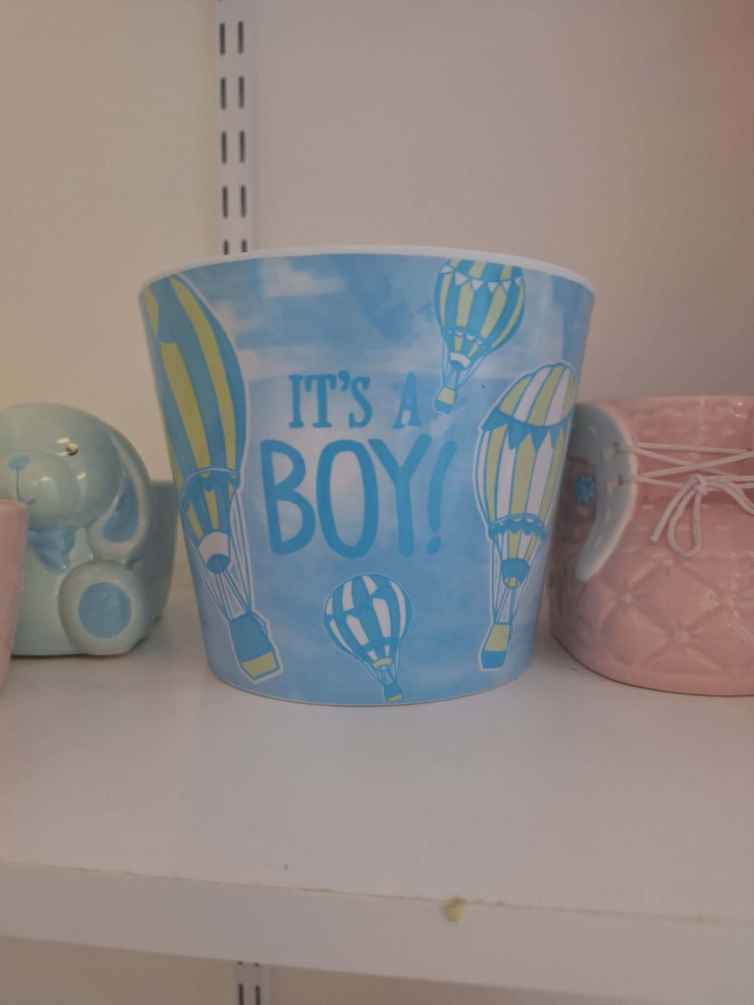 Blue baby gift bucket with hot air balloons and "It's a Boy!" text