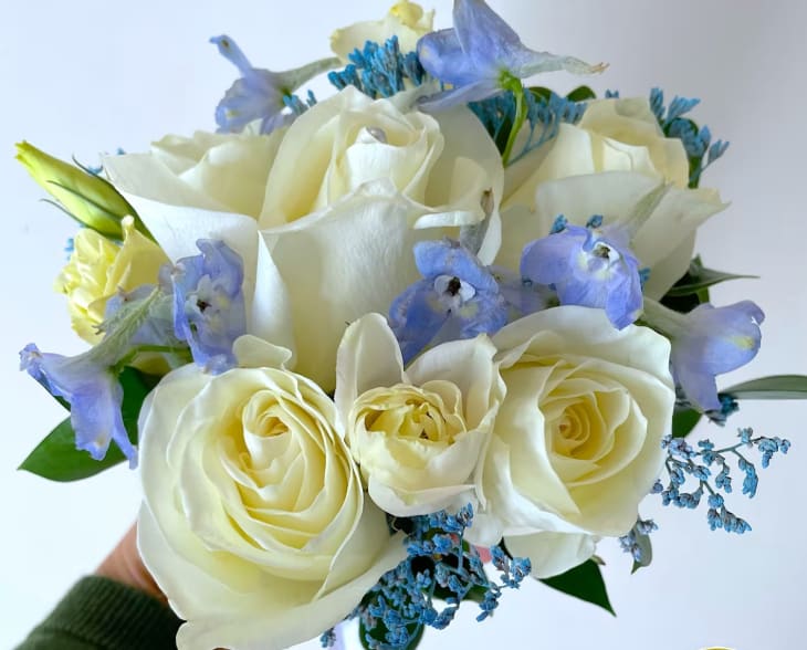 White w/Light Blue Prom Bouquet - White roses with a hint of light blue for just the right touch of elegance. The deluxe version includes a matching boutonniere. The roses can come in a variety of colors include color choice in the notes if ordering online.