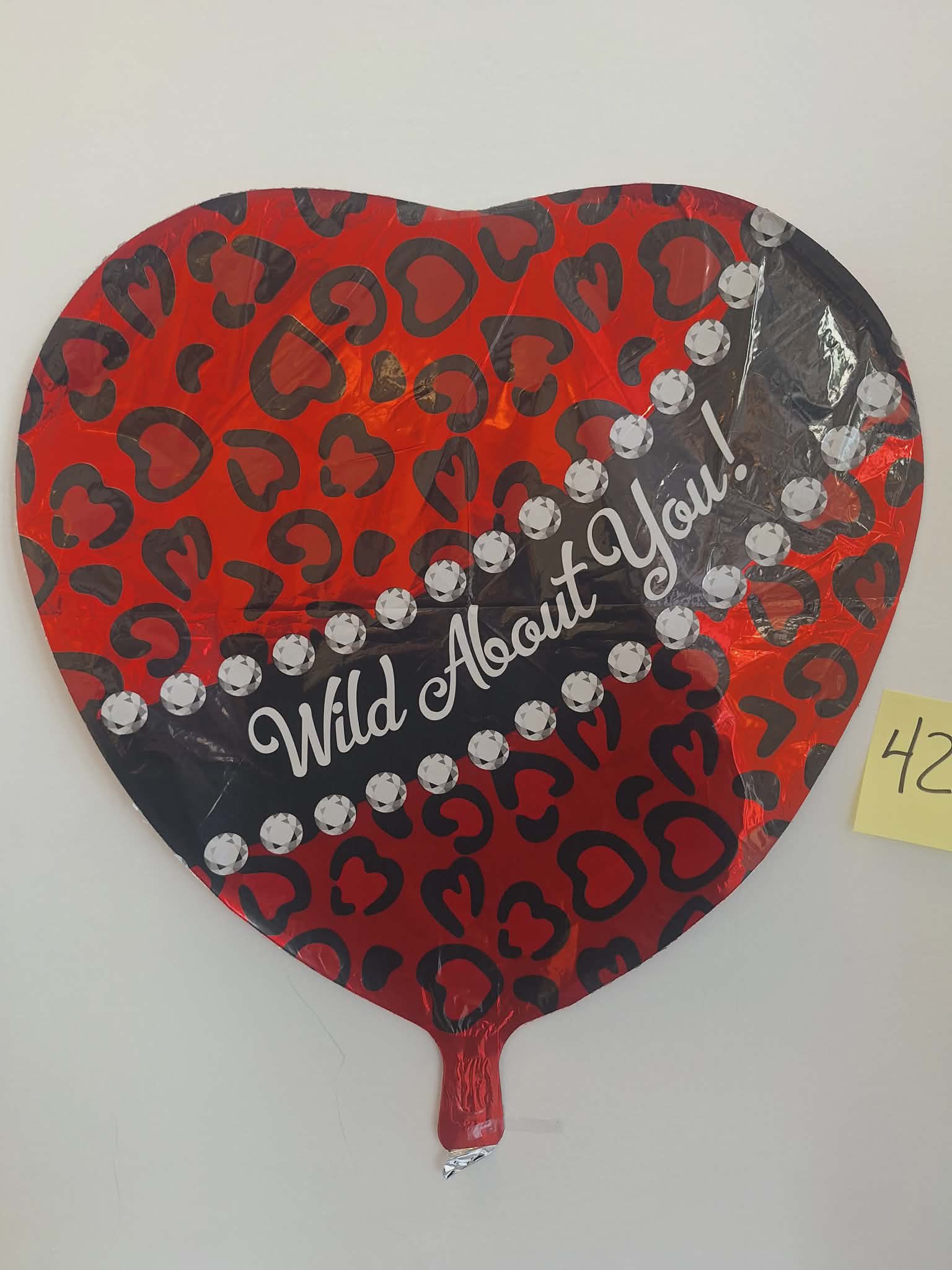 Wild About You (#423) - 18in mylar balloon that you can add to any balloon bouquet, stuffed animal, mug, or box of chocolates. *if you're ordering multiple balloons individually (not in an already advertised set or tied to a flower arrangement/stuffed animal) you will need to purchase a balloon weight otherwise the balloons will need to be picked up*