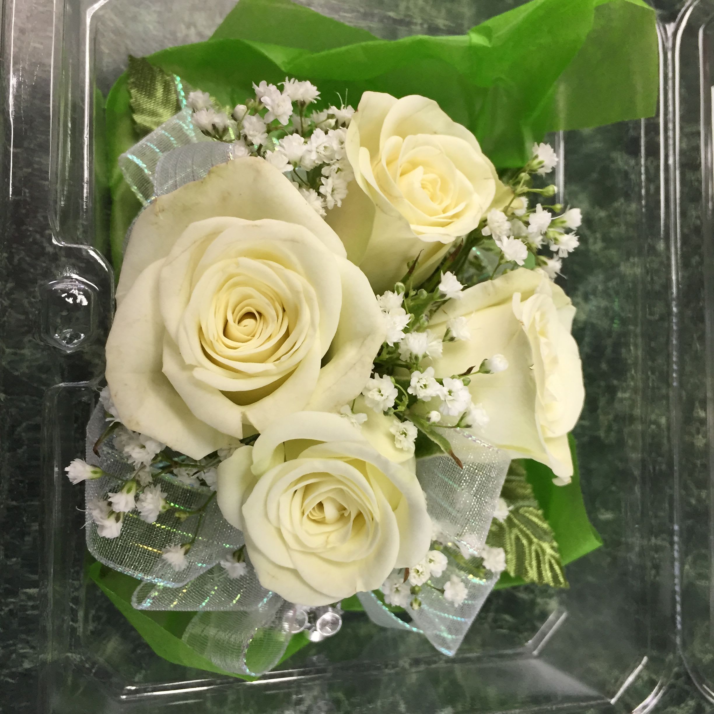 Bouquet of cream roses with small white filler flowers