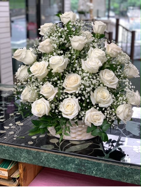 Bountiful Rose Basket - A beautiful, bountiful basket of luminous roses that feels so fresh, natural, and welcomed in a home or at a service.  Can be designed in other colors. Please note that although we always have  roses available - we may not have the larger quantities needed to create this arrangement on short notice. 