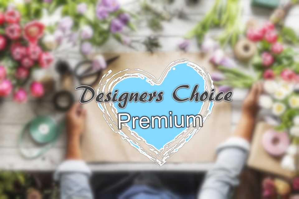 Blurred floral workspace with a "Designers Choice Premium" heart graphic