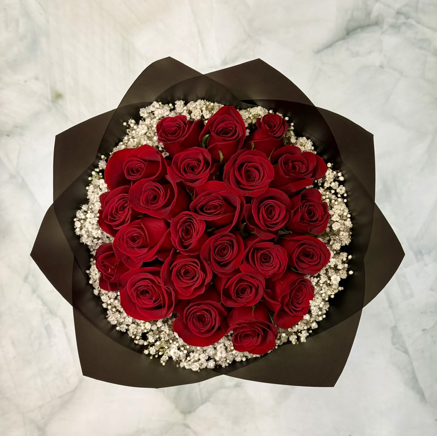 Love and Romance Rose Bouquet  - This bouquet includes 24 classy red roses wrapped in special waterproof floral wrapping paper. They are designed in a perfectly round bouquet. 