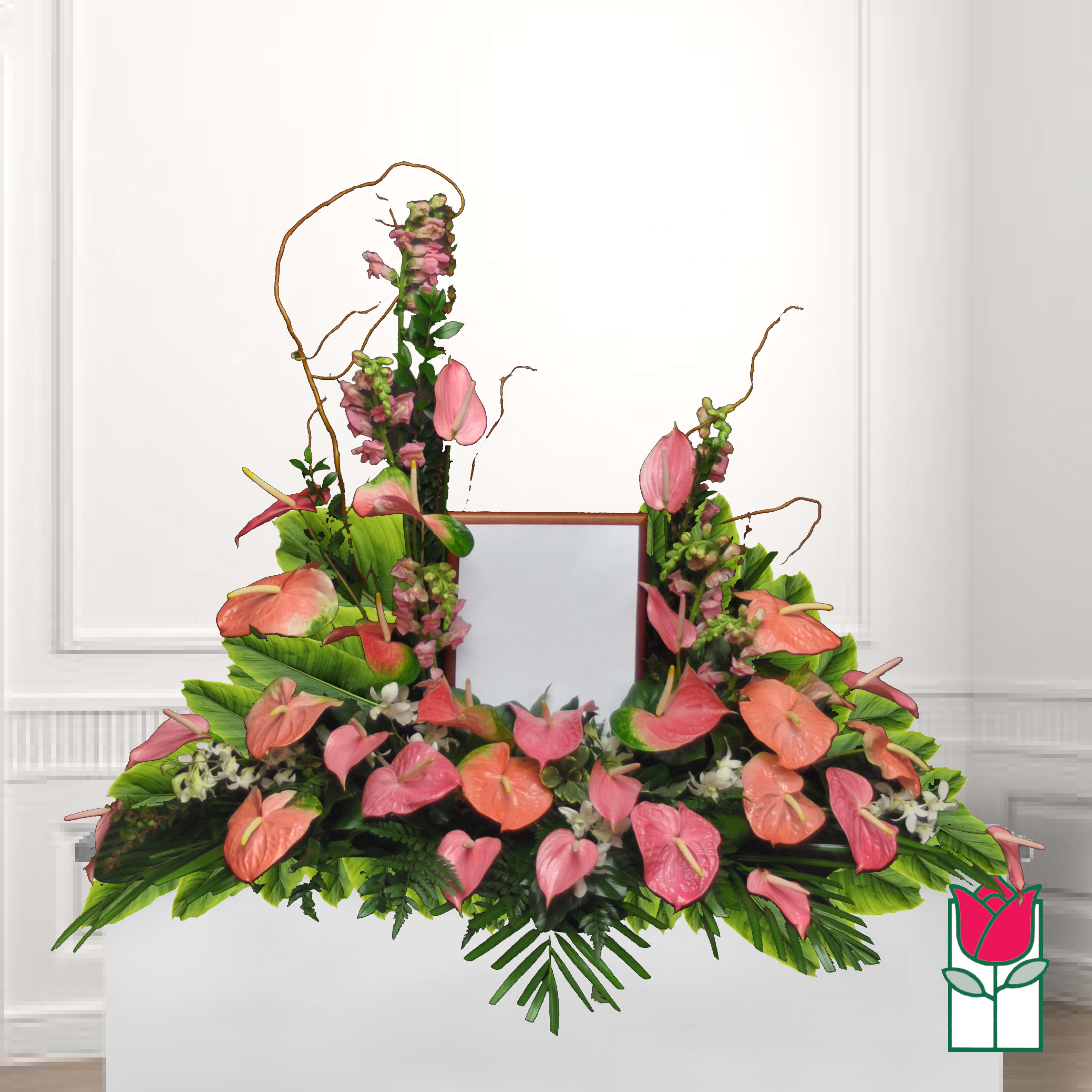 Pink and coral anthurium arrangement with tall pink spikes and greenery