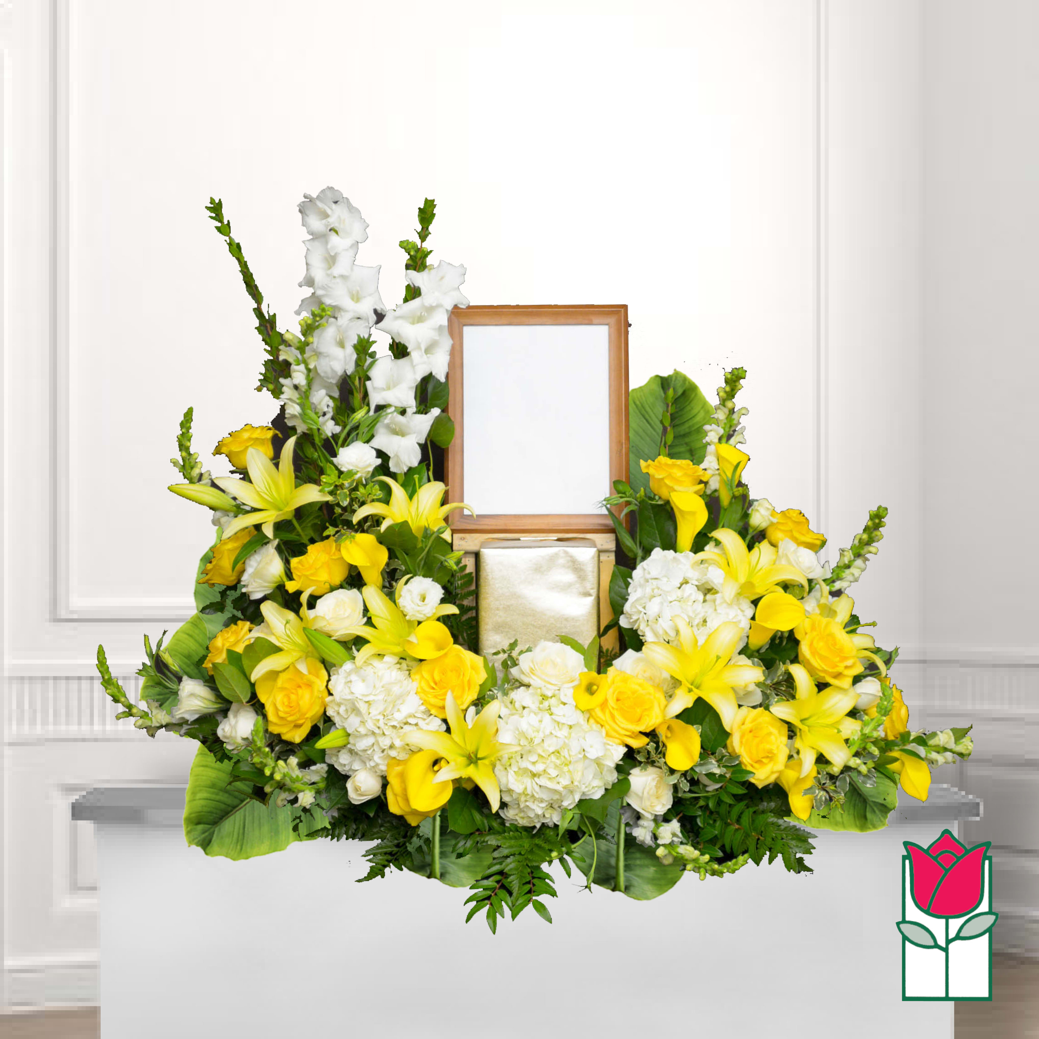 Yellow and white floral funeral tribute with a framed photo holder