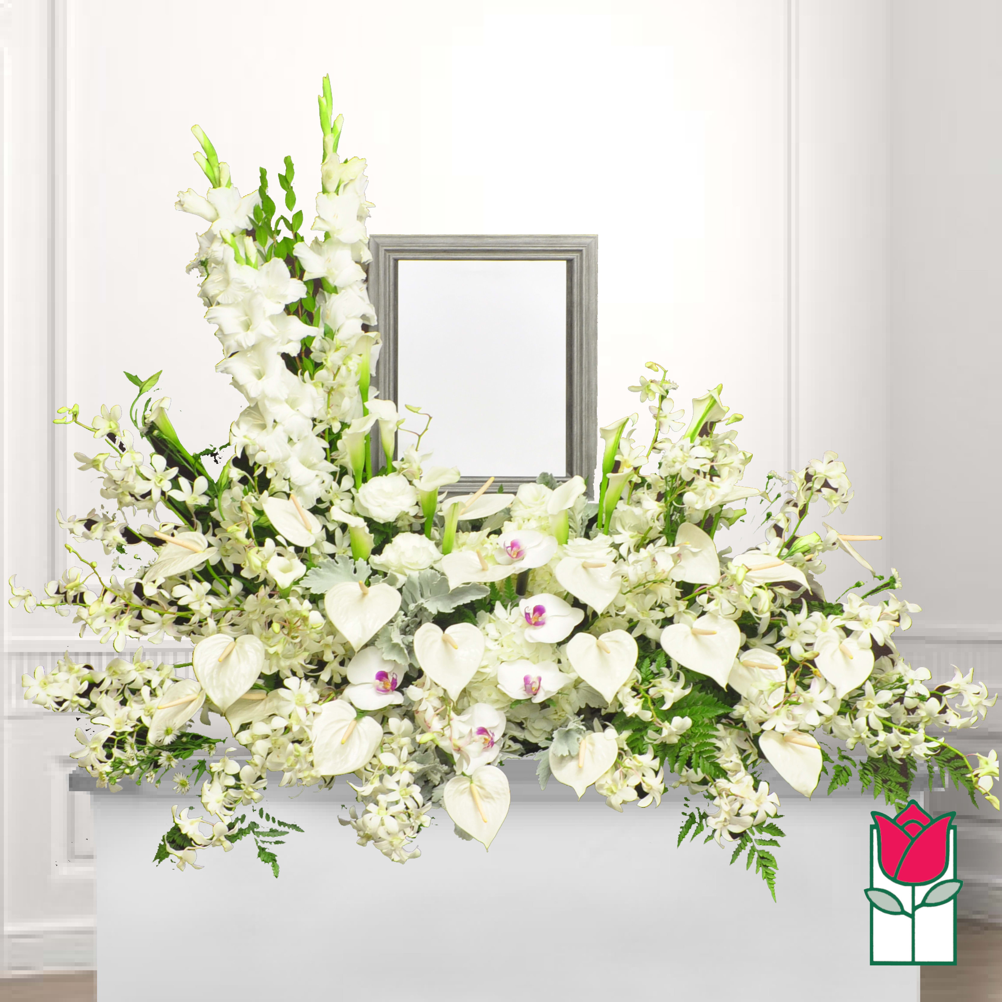 White floral casket spray with orchids and calla lilies