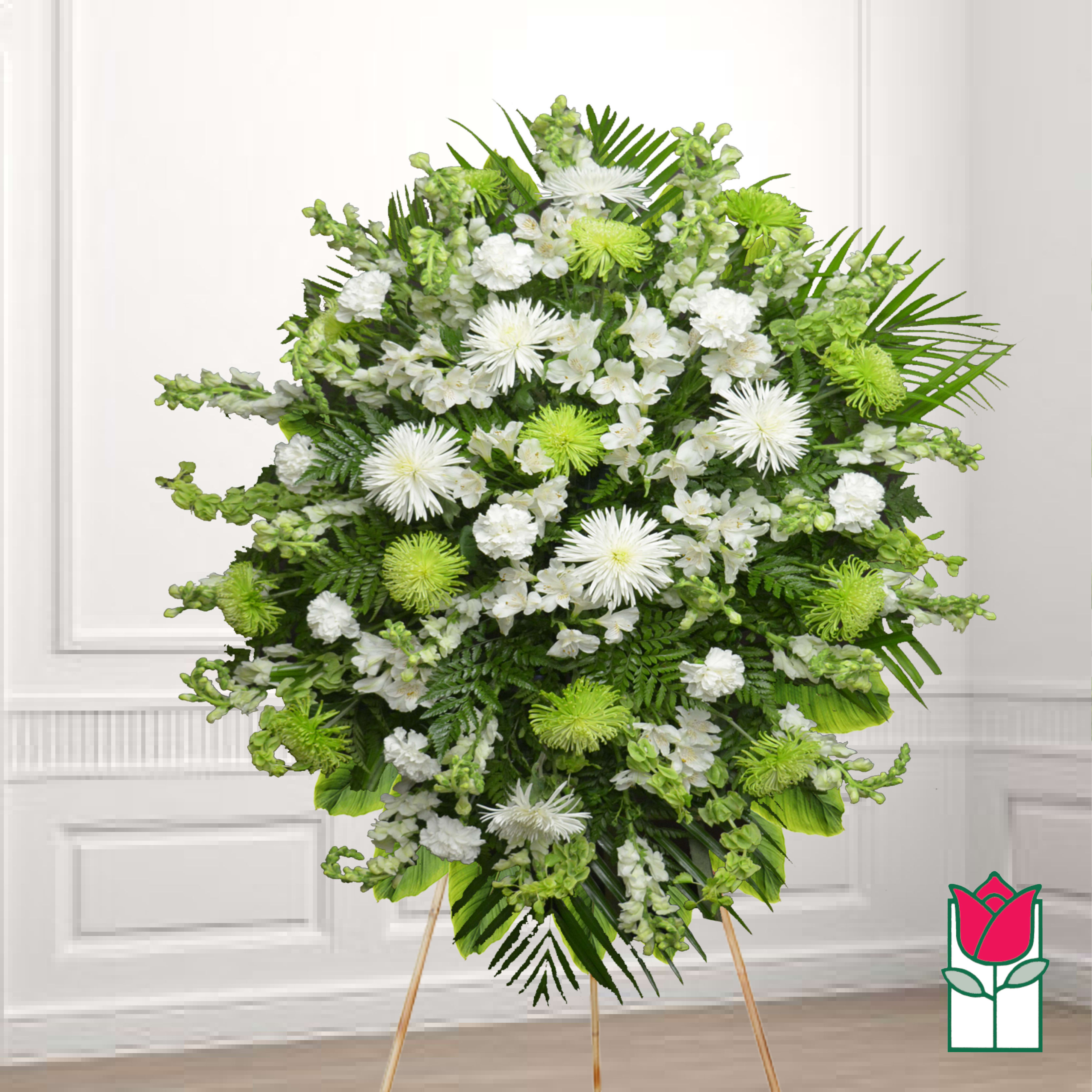 Standing floral spray of white and green flowers on a wooden easel