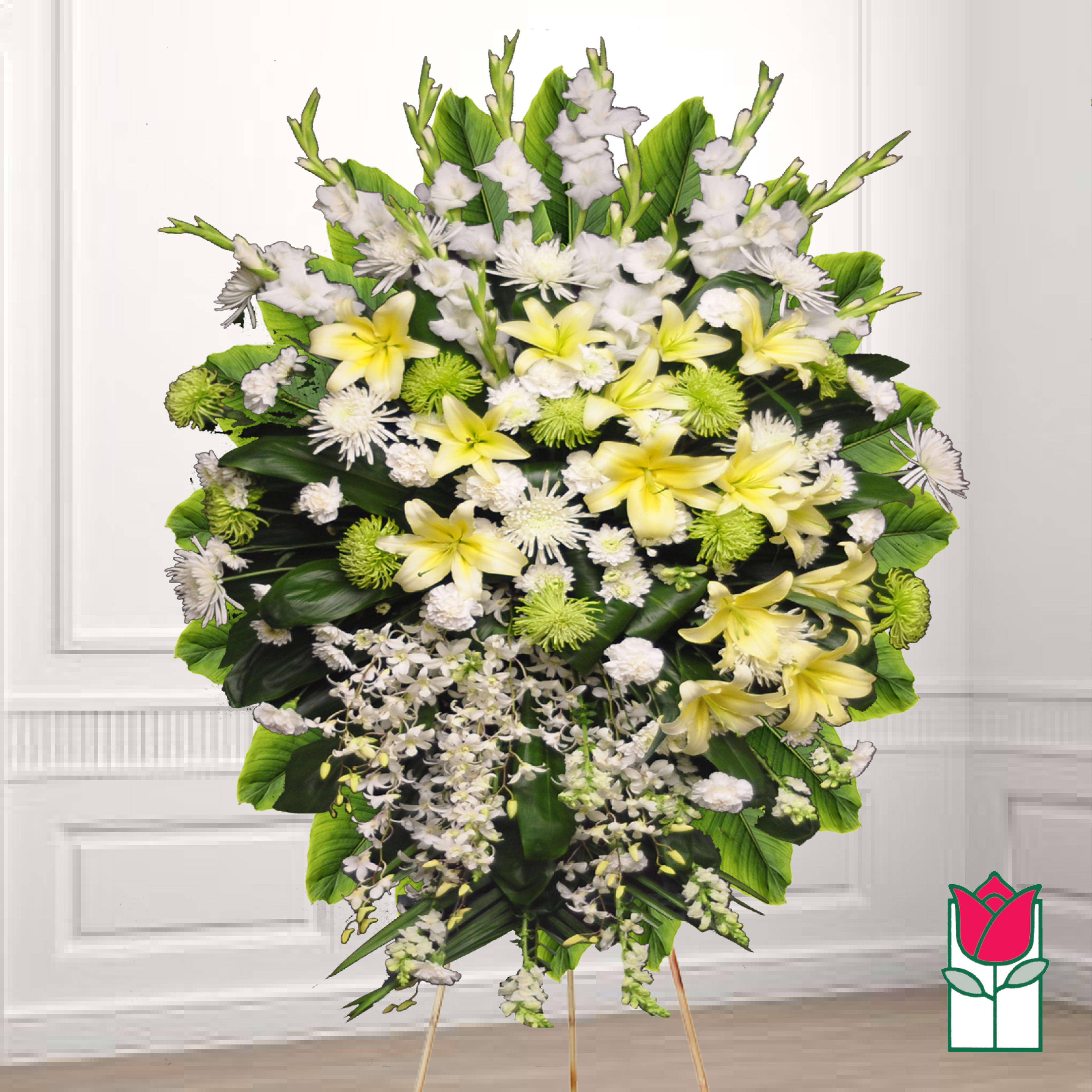 Large standing floral spray with yellow lilies and white flowers