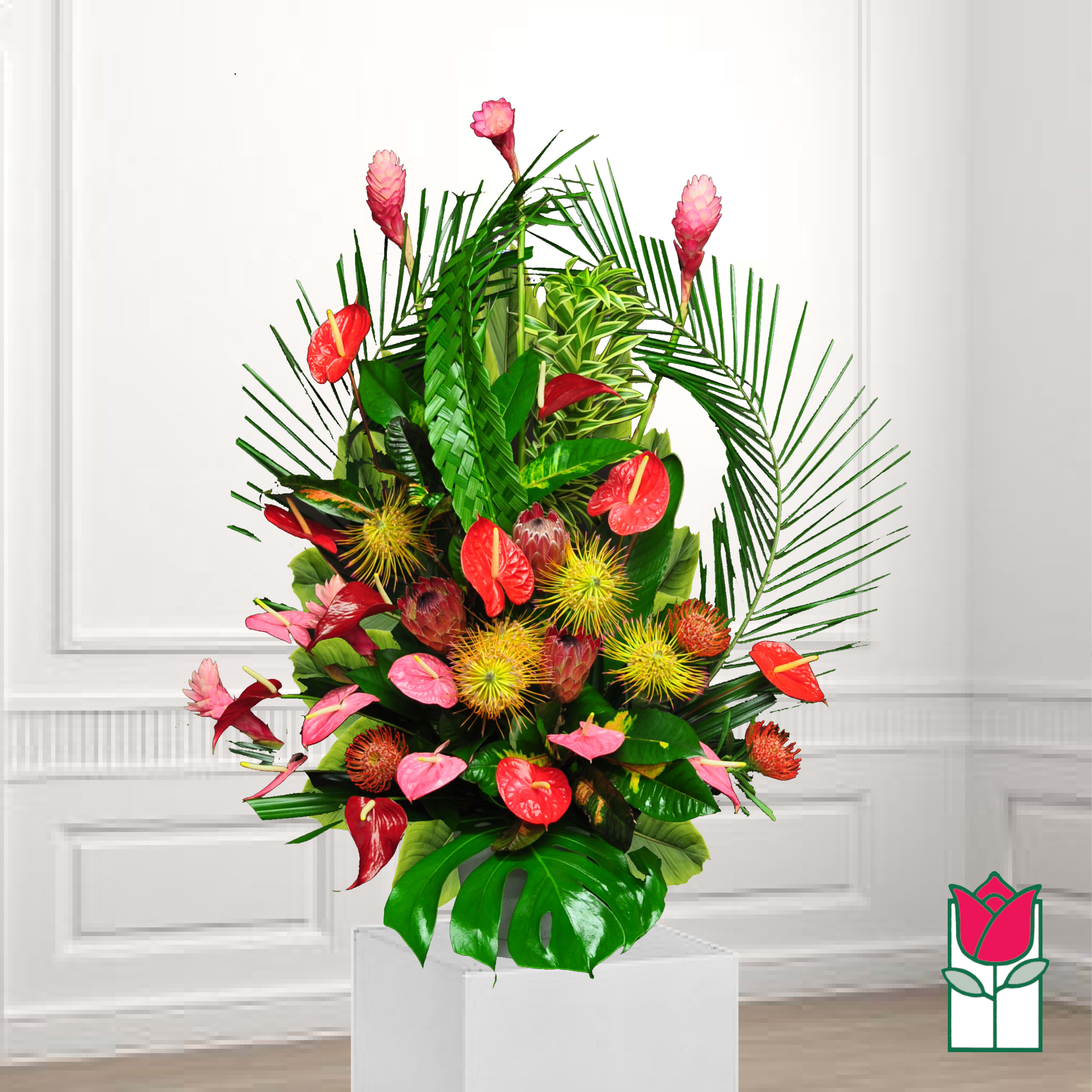 Tropical arrangement with red anthuriums and pink ginger flowers