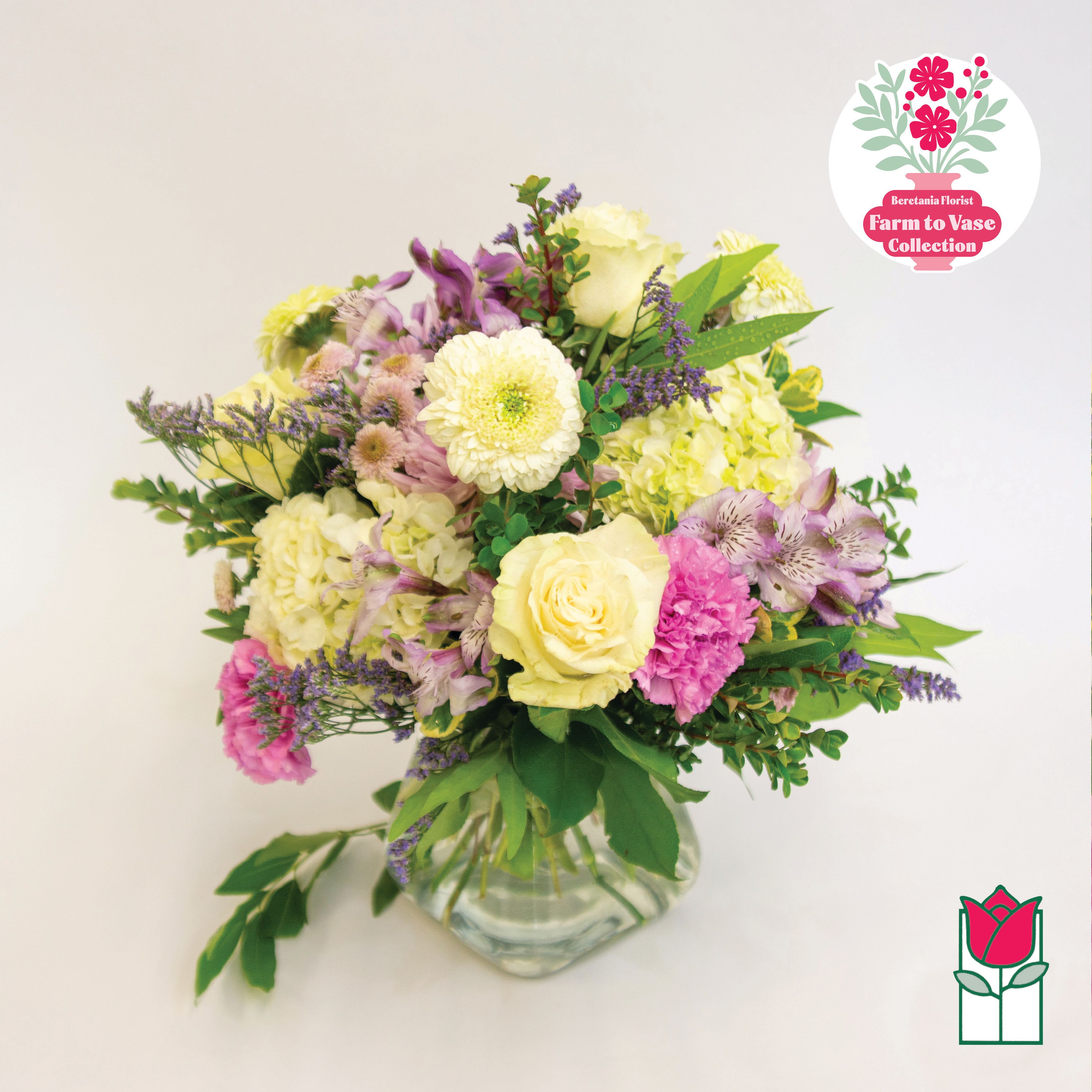 Mixed pastel bouquet in a clear glass vase