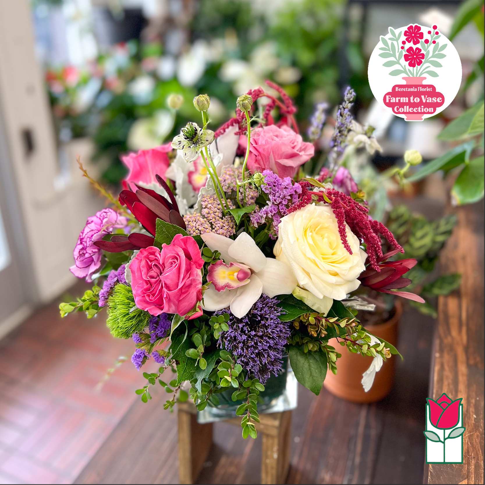 Mixed bouquet with pink and cream roses in a glass vase