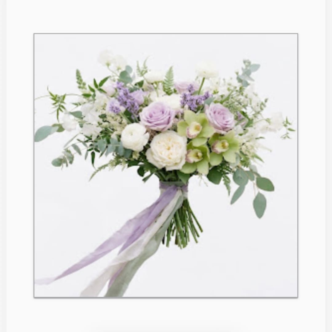 Wedding bouquet of lavender and white flowers with trailing ribbon