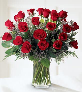 Bouquet of red roses in a clear glass vase