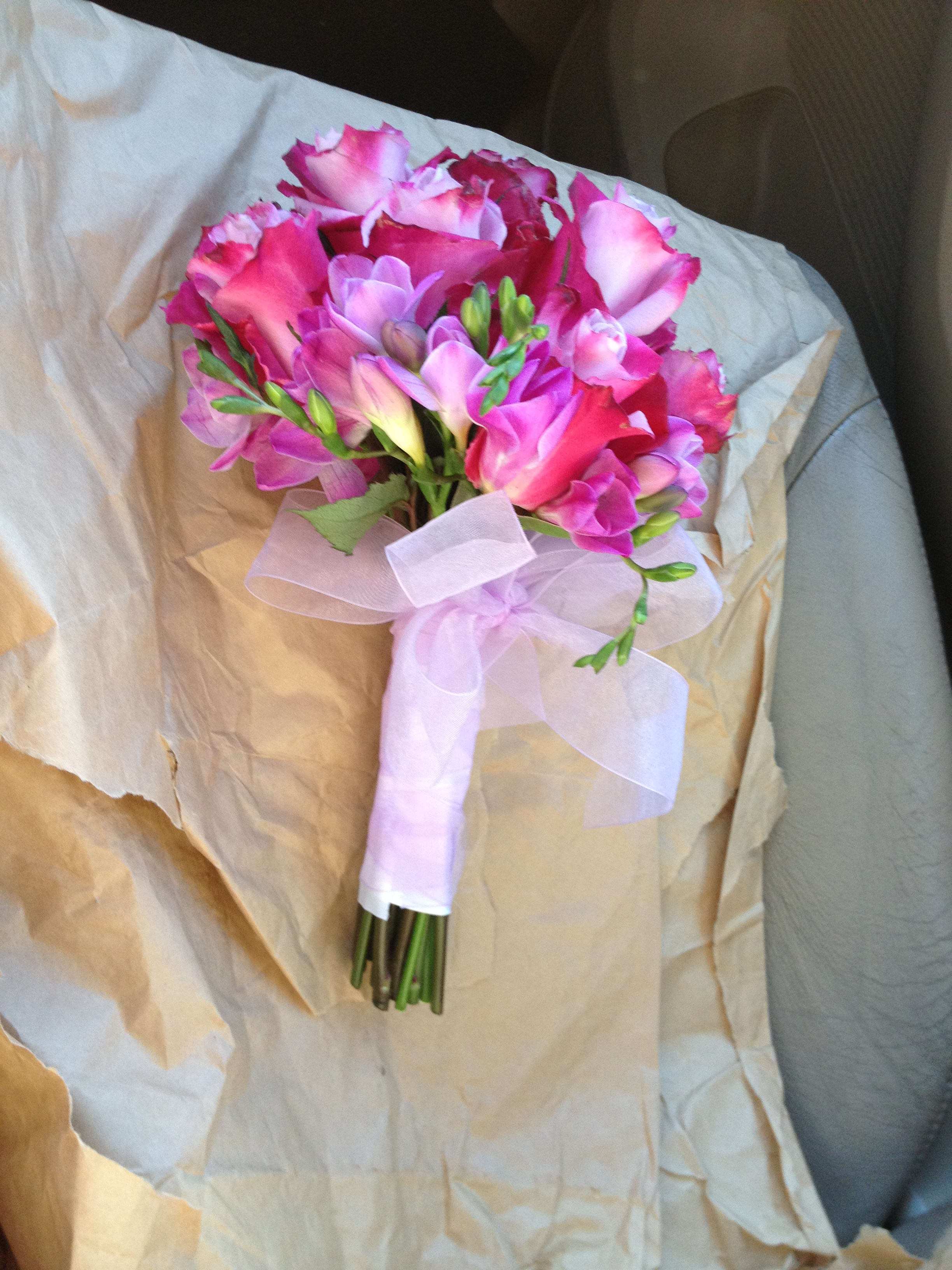 Pink and lavender bouquet wrapped with a pale ribbon