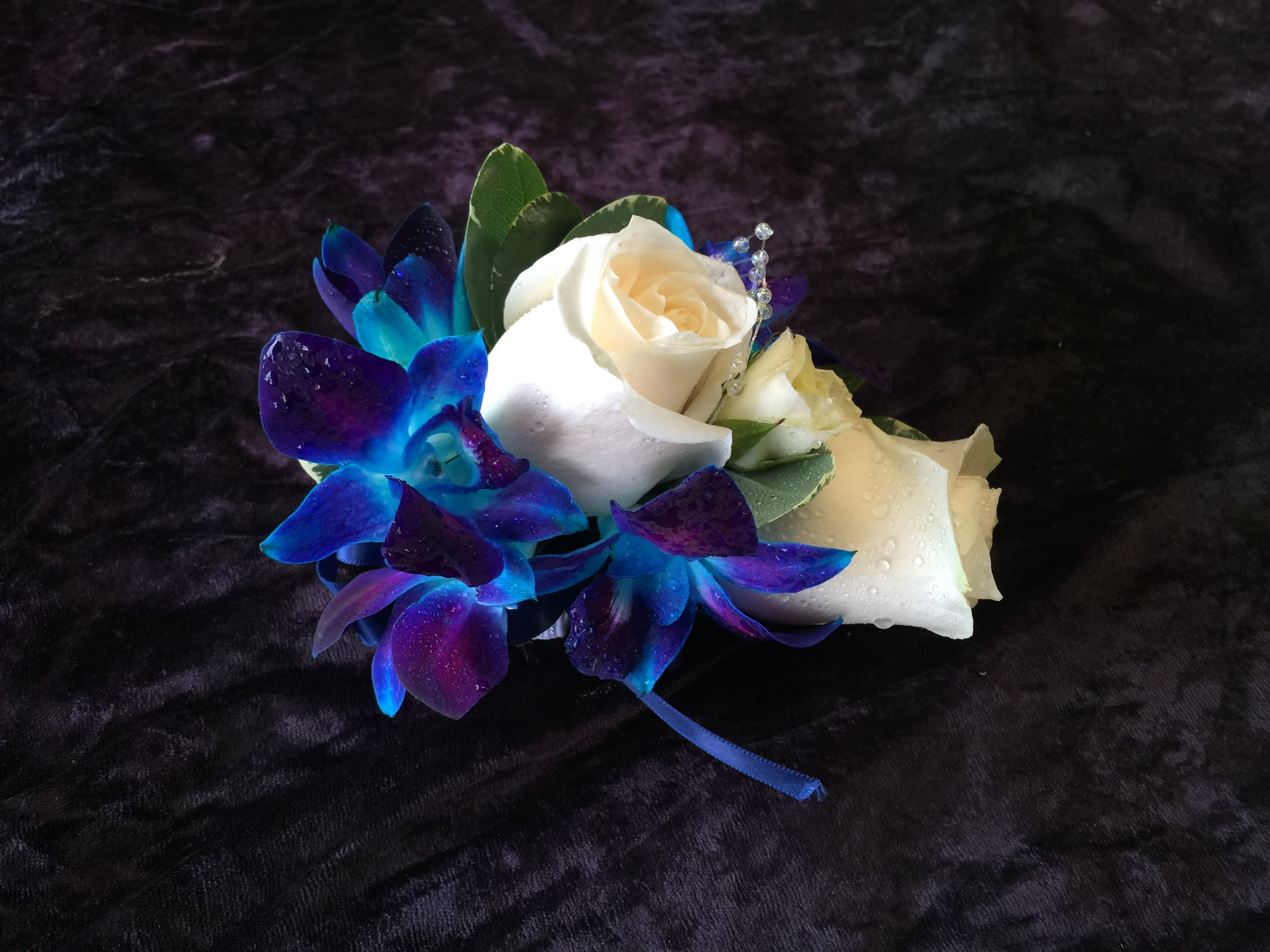 Small bouquet with white roses and blue-purple orchids