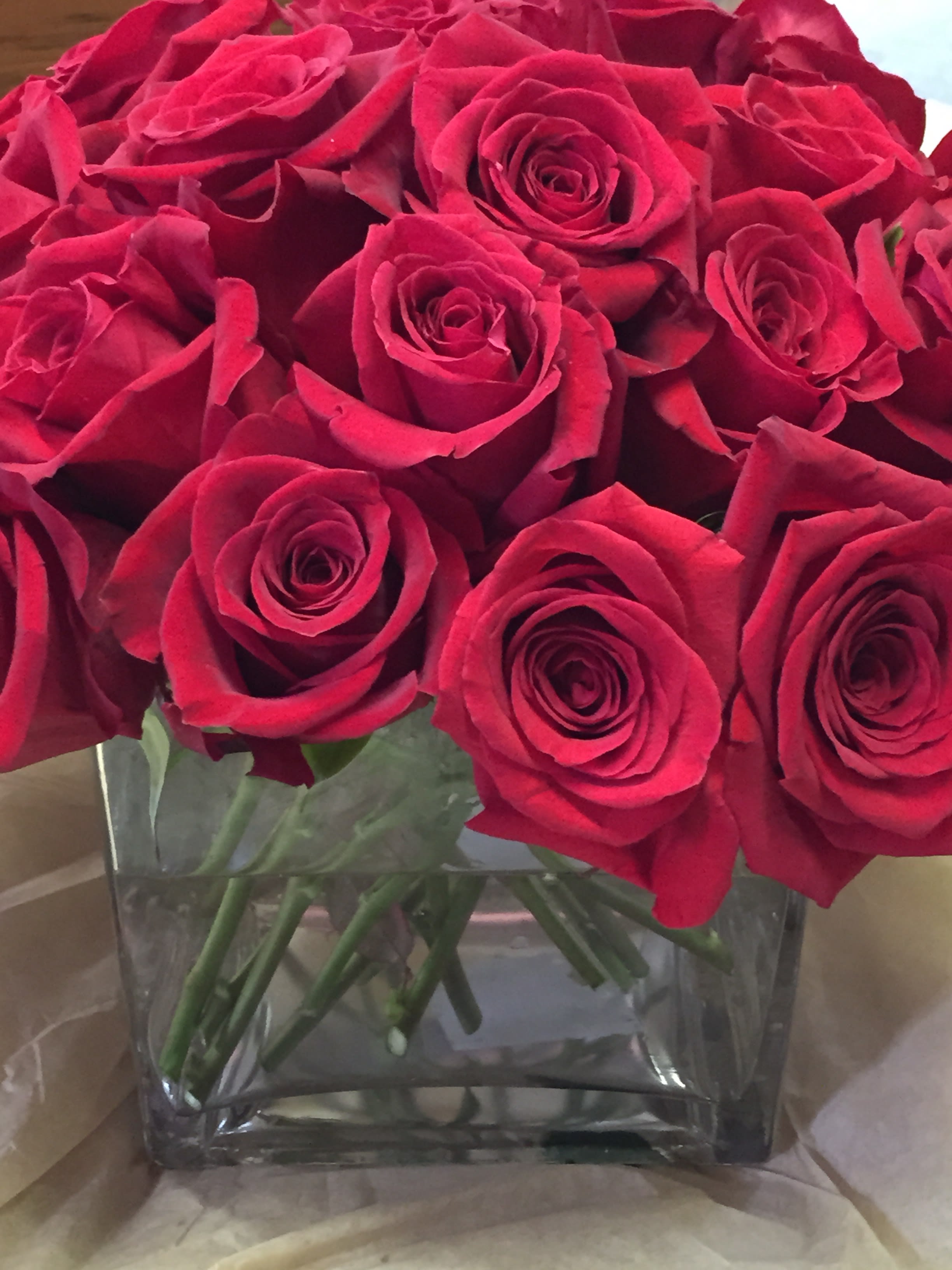 Bouquet of red roses in a clear glass vase