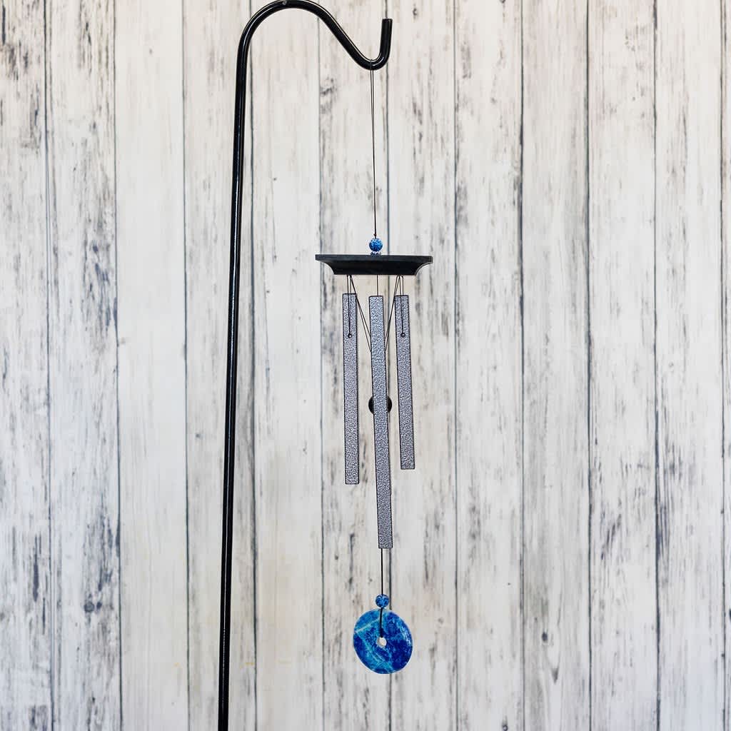 Hanging metal wind chime with blue accents