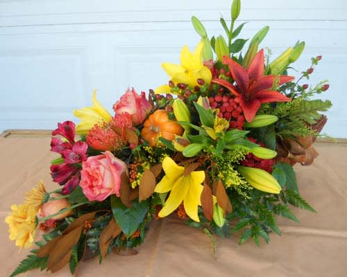 Colorful floral arrangement with lilies and roses on a table