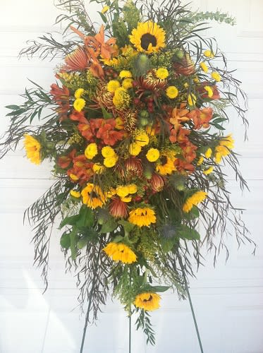 Tall standing floral spray with yellow and orange flowers