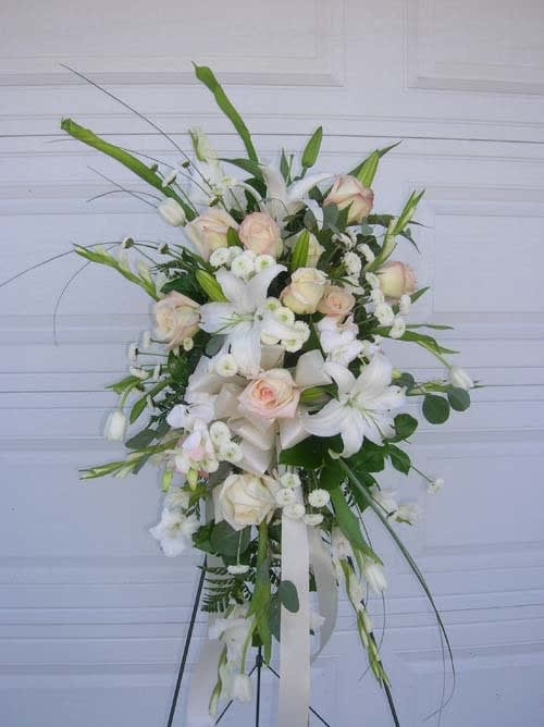 Tall white and blush floral spray on a stand