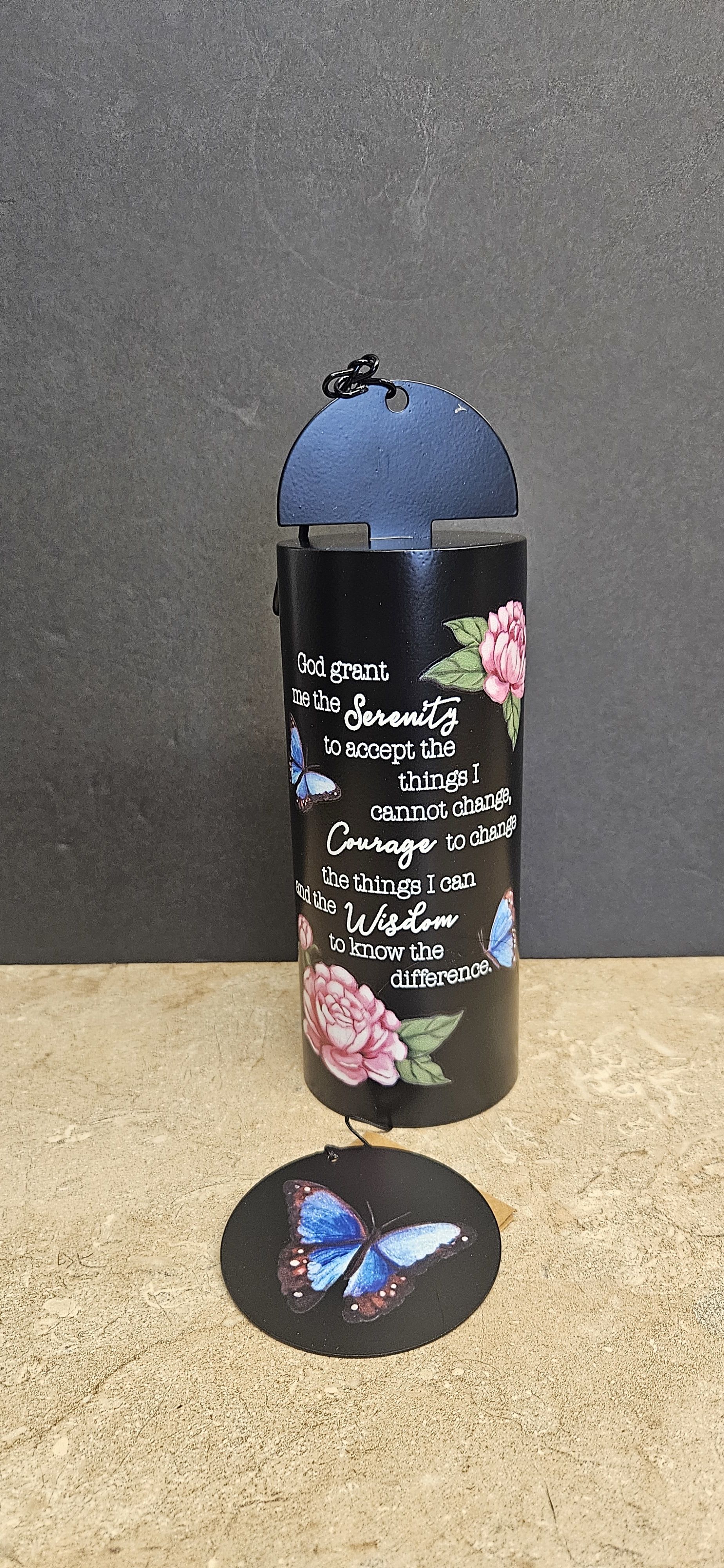 Black cylindrical holder with a Serenity prayer and butterfly and flower designs