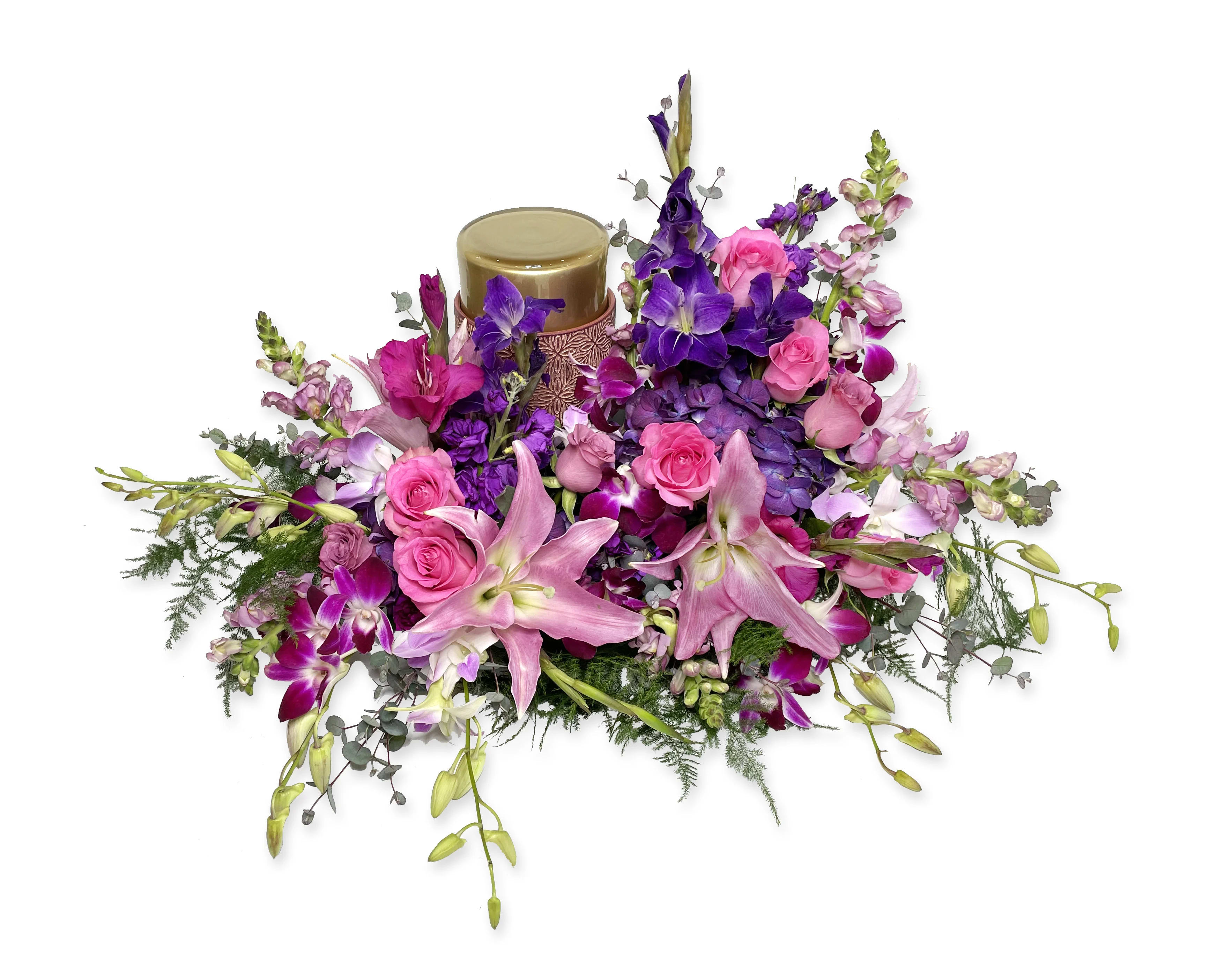 Pink and purple floral arrangement with a candle centerpiece