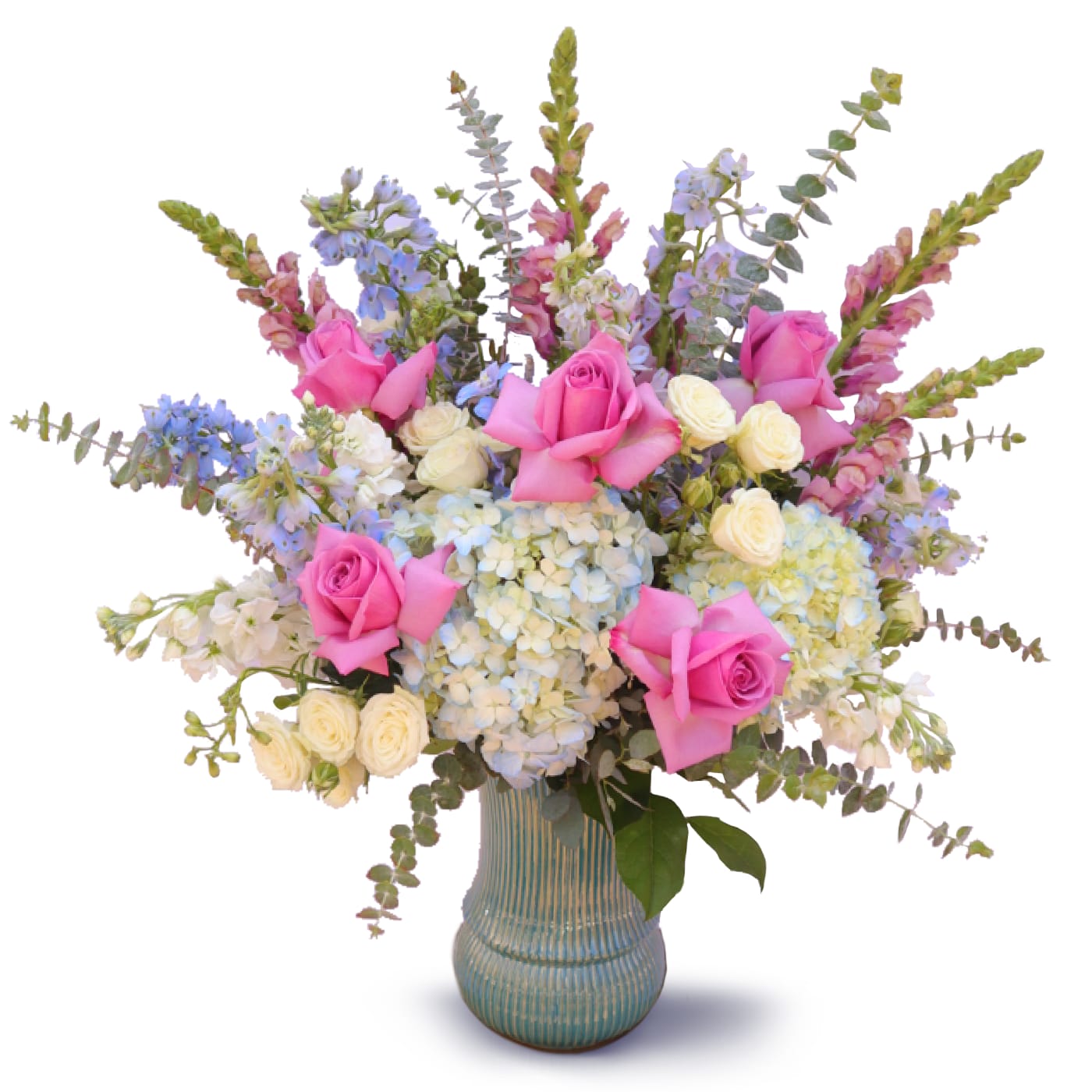 Pink roses and pastel flowers arranged in a blue vase