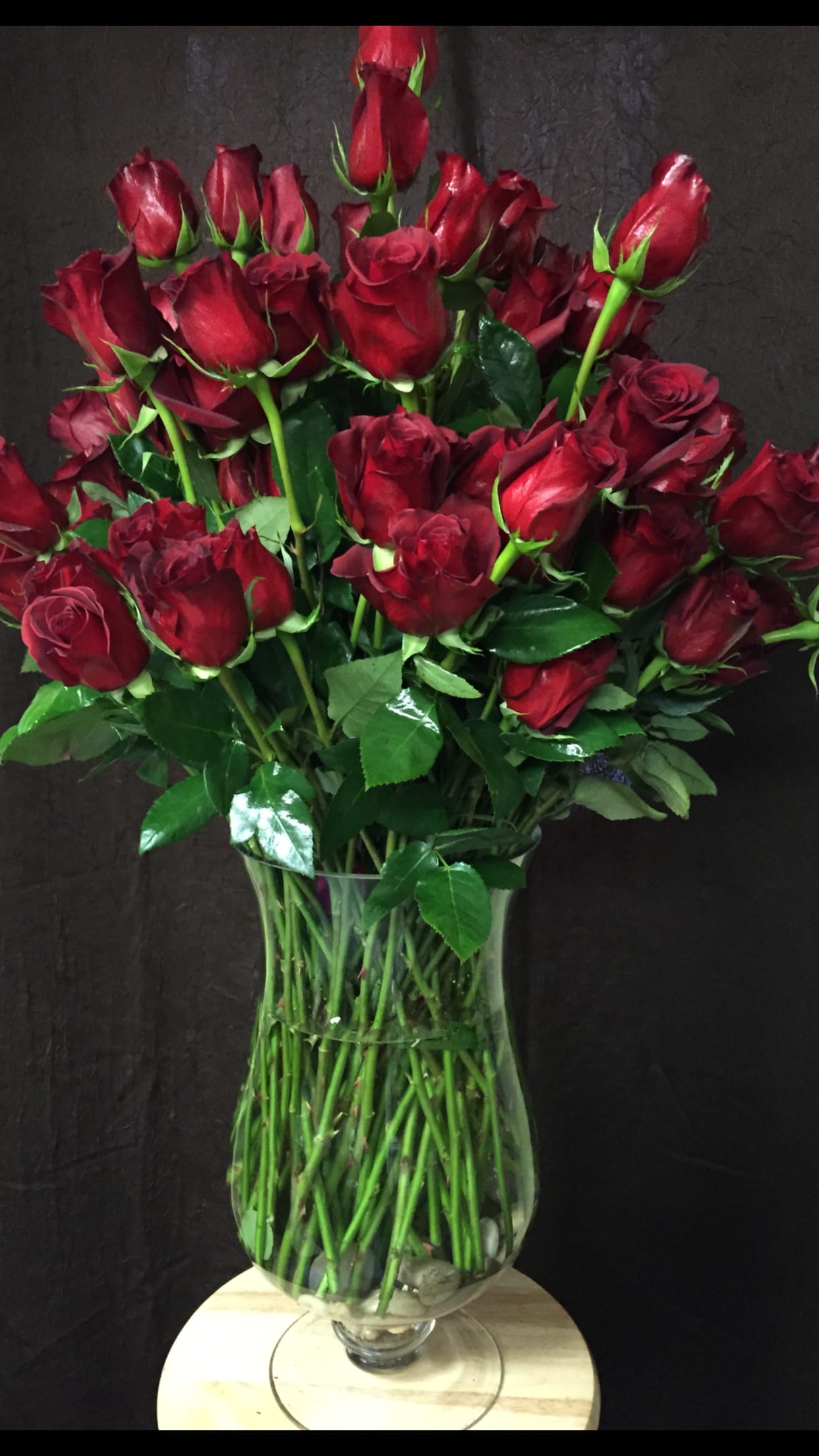 Bouquet of red roses in a clear glass vase