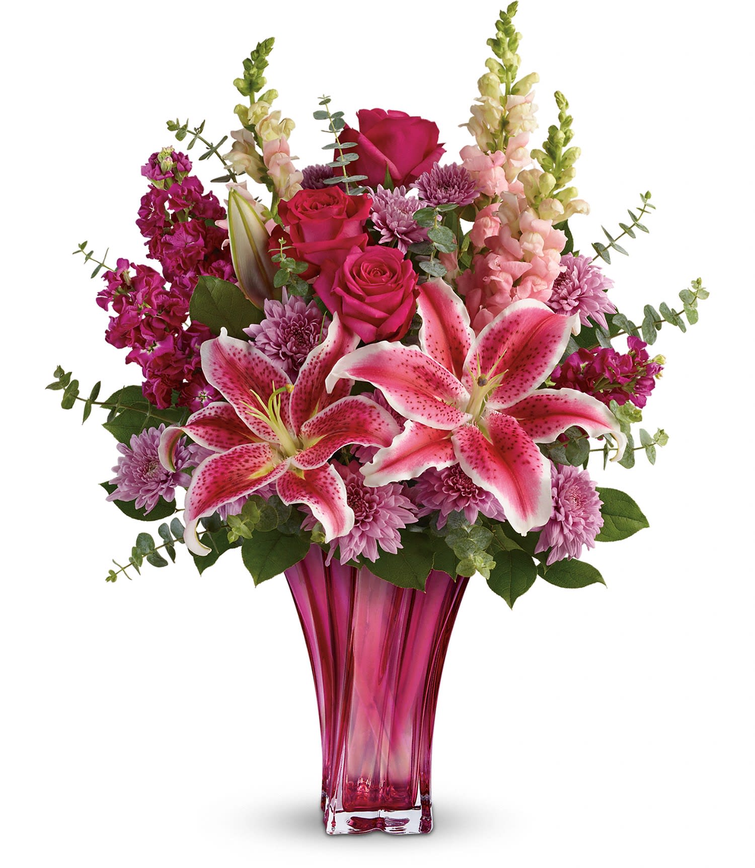 Teleflora's Bold Elegance Bouquet - This elegant bouquet features hot pink roses, pink stargazer lilies, burgundy stock, lavender cushion spray chrysanthemums, pink snapdragons, spiral eucalyptus, and lemon leaf. Delivered in a Bold Elegance vase. Approximately 19 1/2" W x 24 1/2" H