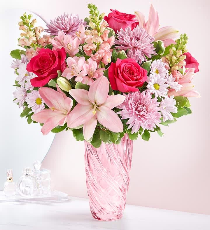 Pink and white mixed bouquet in a pink glass vase