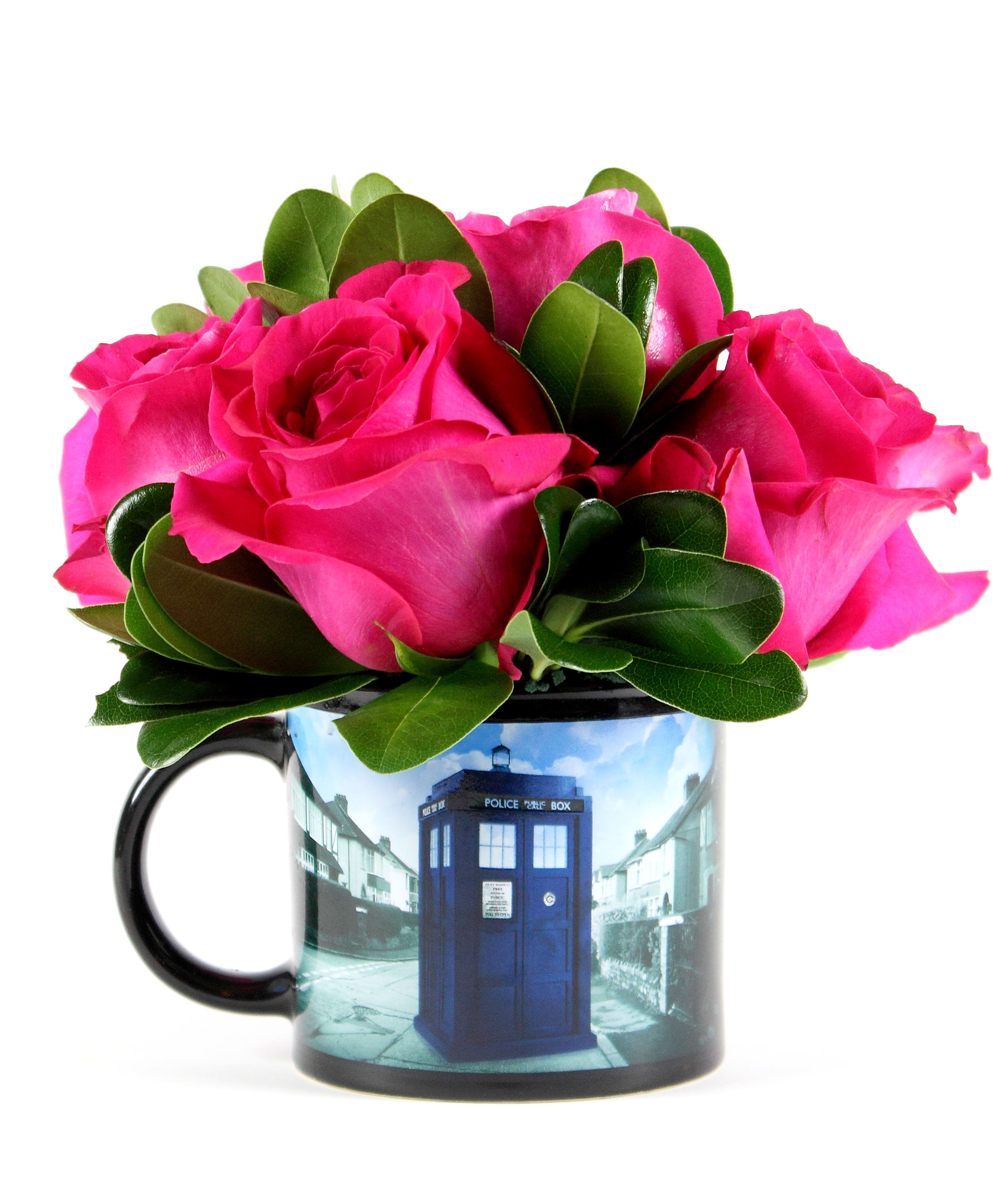 Pink roses arranged in a mug with a blue police box design