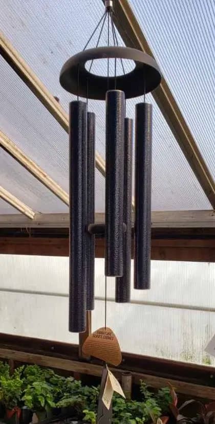Black hanging wind chime with long tubular pipes