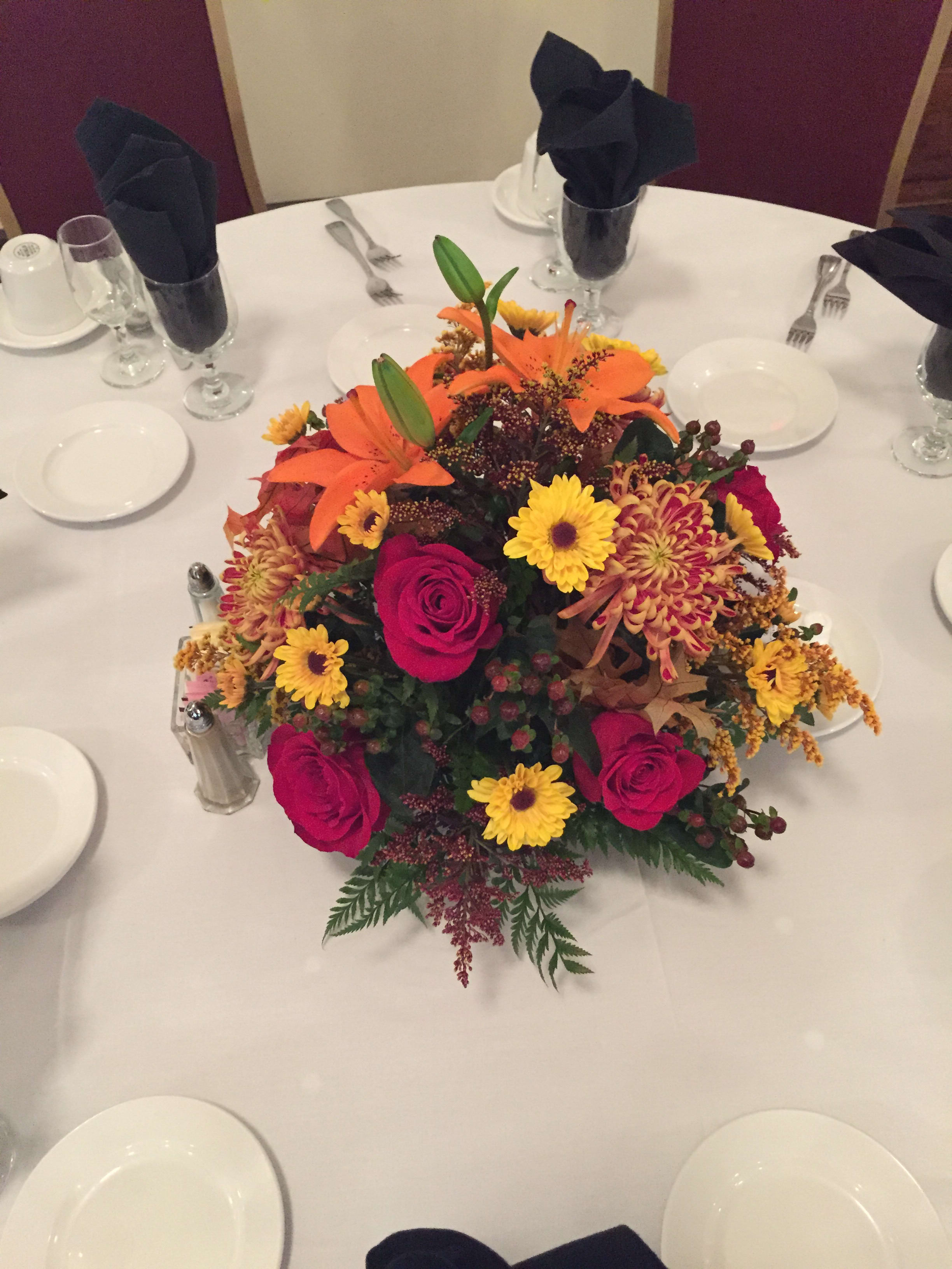 Eckert Florist's Thanksgiving Centerpiece - A traditional Thanksgiving centerpiece for any table in your house!  Flowers &amp; Containers may vary depending on availability.