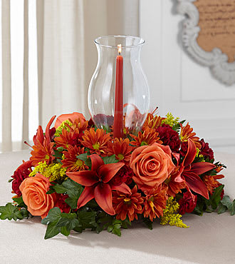 Eckert Florist's Harvest Centerpiece - The Harvest Centerpiece exudes warmth and autumn elegance to create the perfect addition to their fall table.  **Candle color may vary.