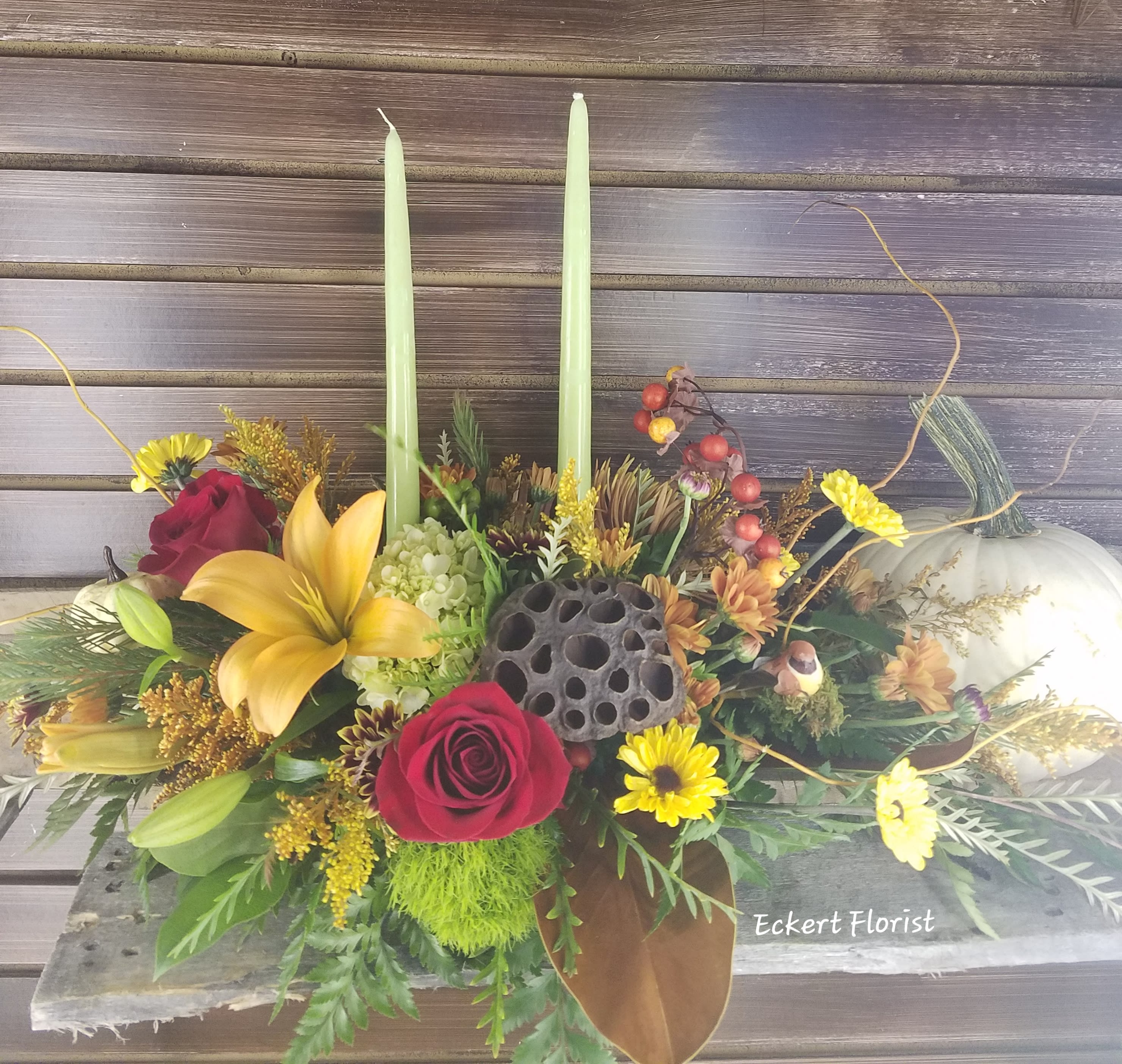 Eckert Florist's Give Thanks Bouquet *LOCAL DELIVERY ONLY - A beautiful Thanksgiving centerpiece that will enhance any Holiday table. *Flowers and candle color may vary.