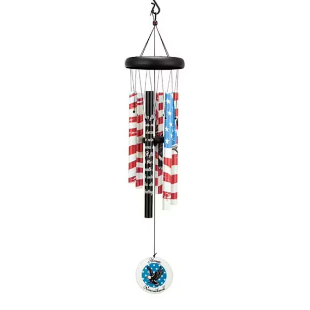 Patriotic wind chime with red, white, and blue tubes and a round medallion