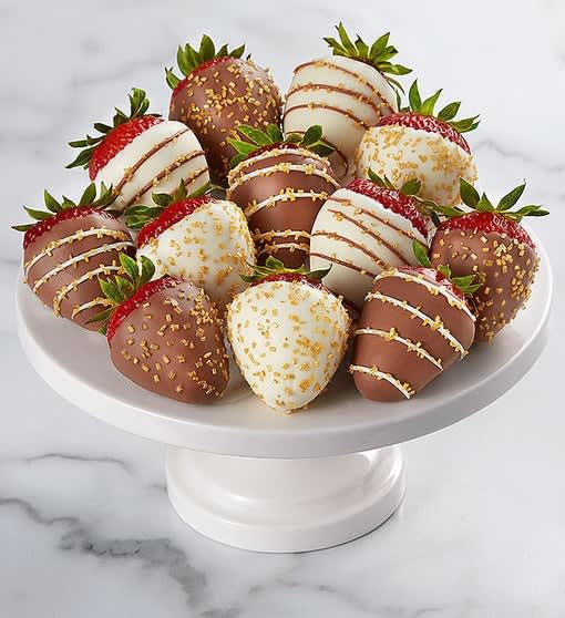 Plate of chocolate-covered strawberries on a white pedestal stand
