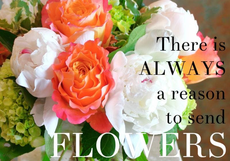 Bouquet of orange and white roses with green hydrangeas and text overlay